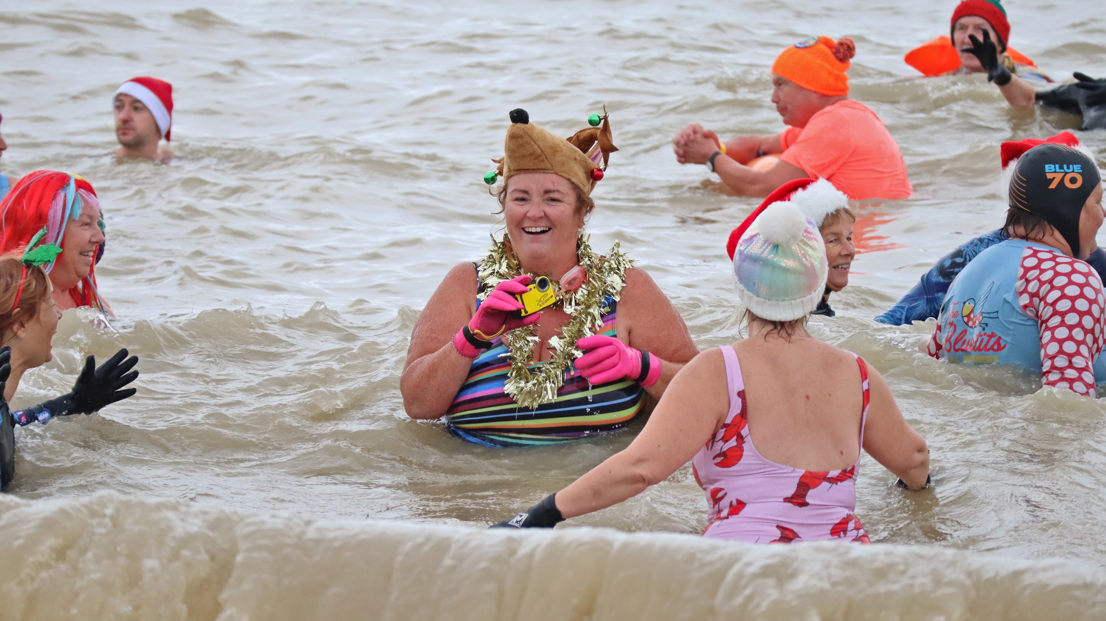 Many of the brave dippers wore festive hats