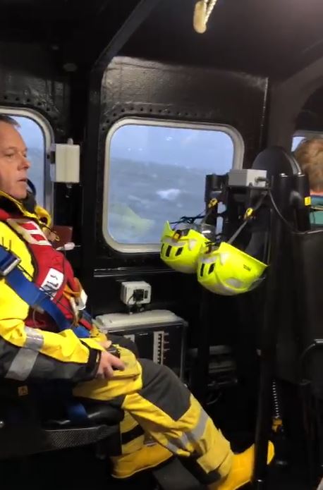 Photo of a crew member well strapped in