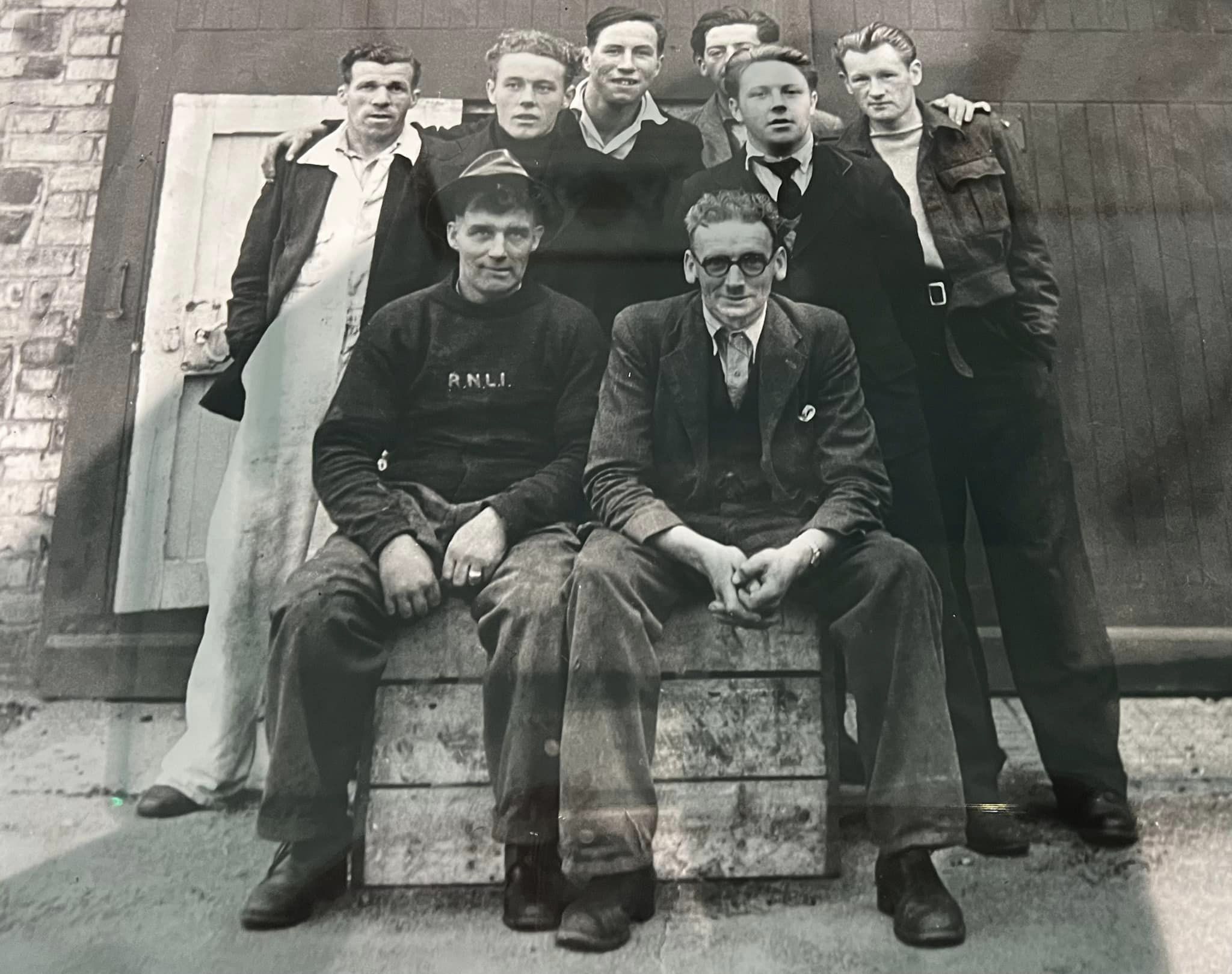 Eight male lifeboat crew