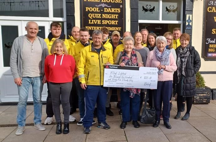 'Belief' Fundraising Group Present Cheque to Rhyl RNLI Crew