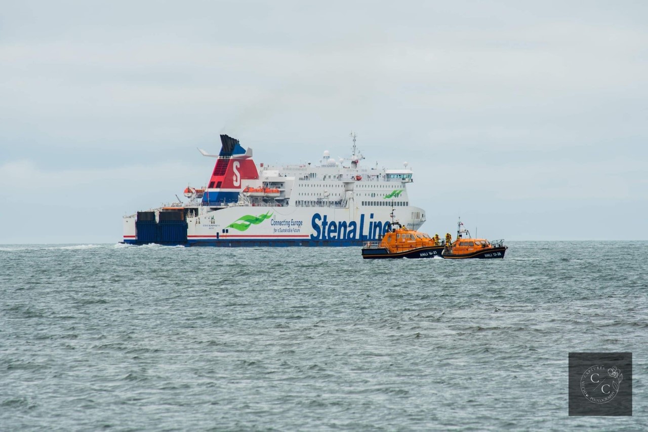RNLI all-weather lifeboats Tamar Class ‘John Buchanan Barr’ of Portpatrick RNLI , Shannon Class ‘Elizabeth and Gertrude Allan’ of Girvan RNLI as they stand clear to allow the Stena Line Ferry to pass in Loch Ryan.