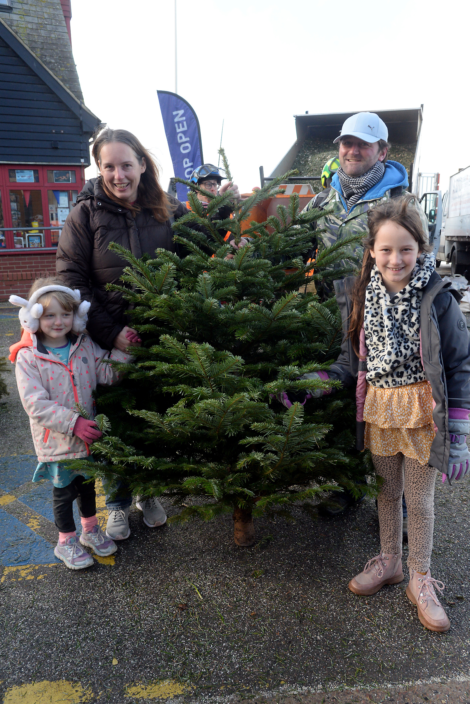 Bluebell, five and Jasmine, nine with parents Roxy and Dominic Everson bade farewell to their tree at the Whitstable lifeboat Christmas tree chipping session outside the boathouse on Sunday.