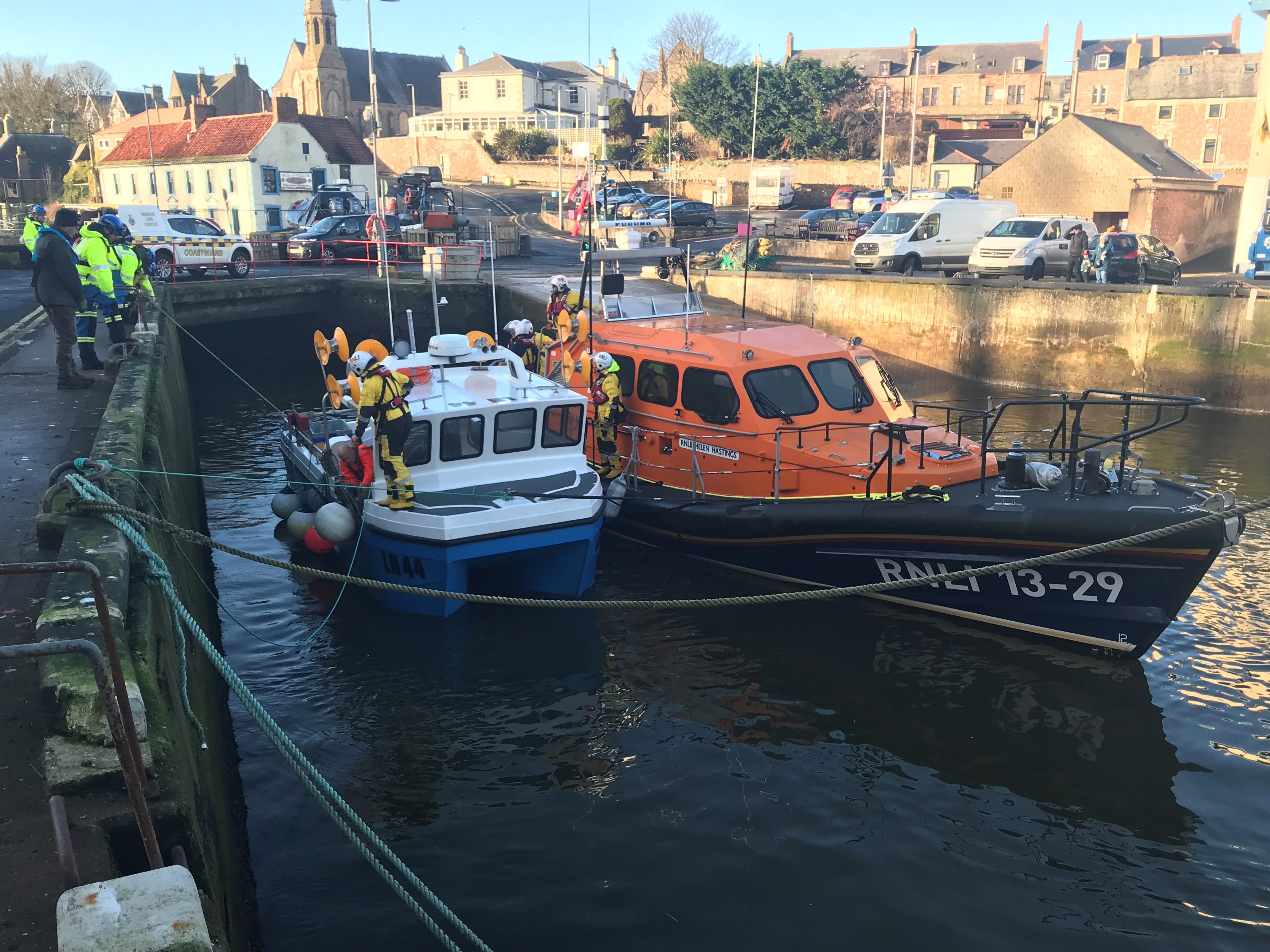 Eyemouth lifeboat towing the fishing boat into Eyemouth harbour 20 January 2023