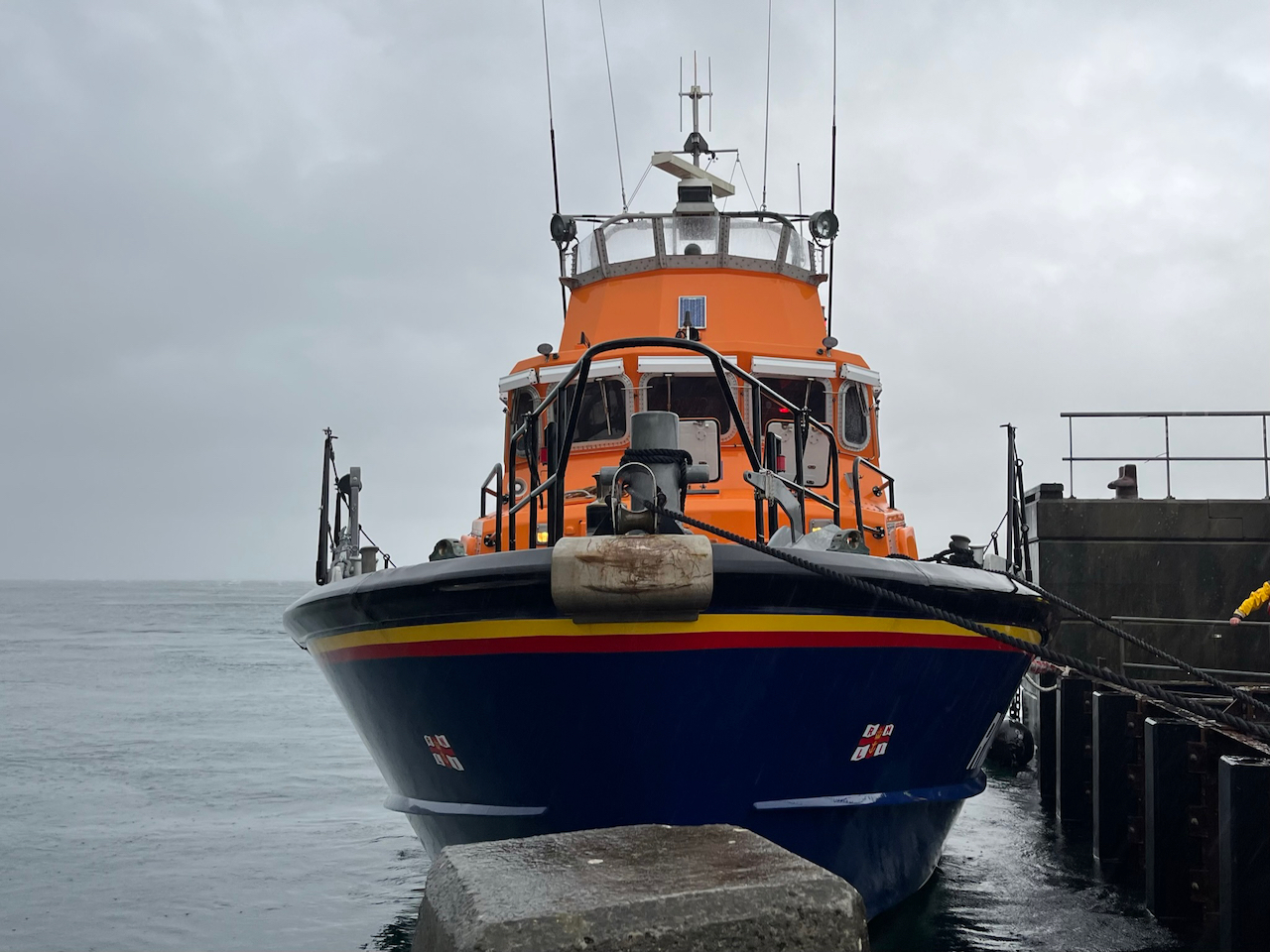 Lifeboat moored at the pier in Port Askaig, looking at the bow from the pier
