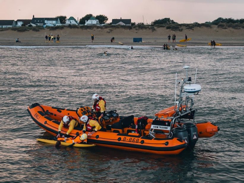 RNLI lifeguards and Southwold lifeboat crew practising transferring casualties