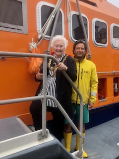 Lady mayor and crew onboard a lifeboat