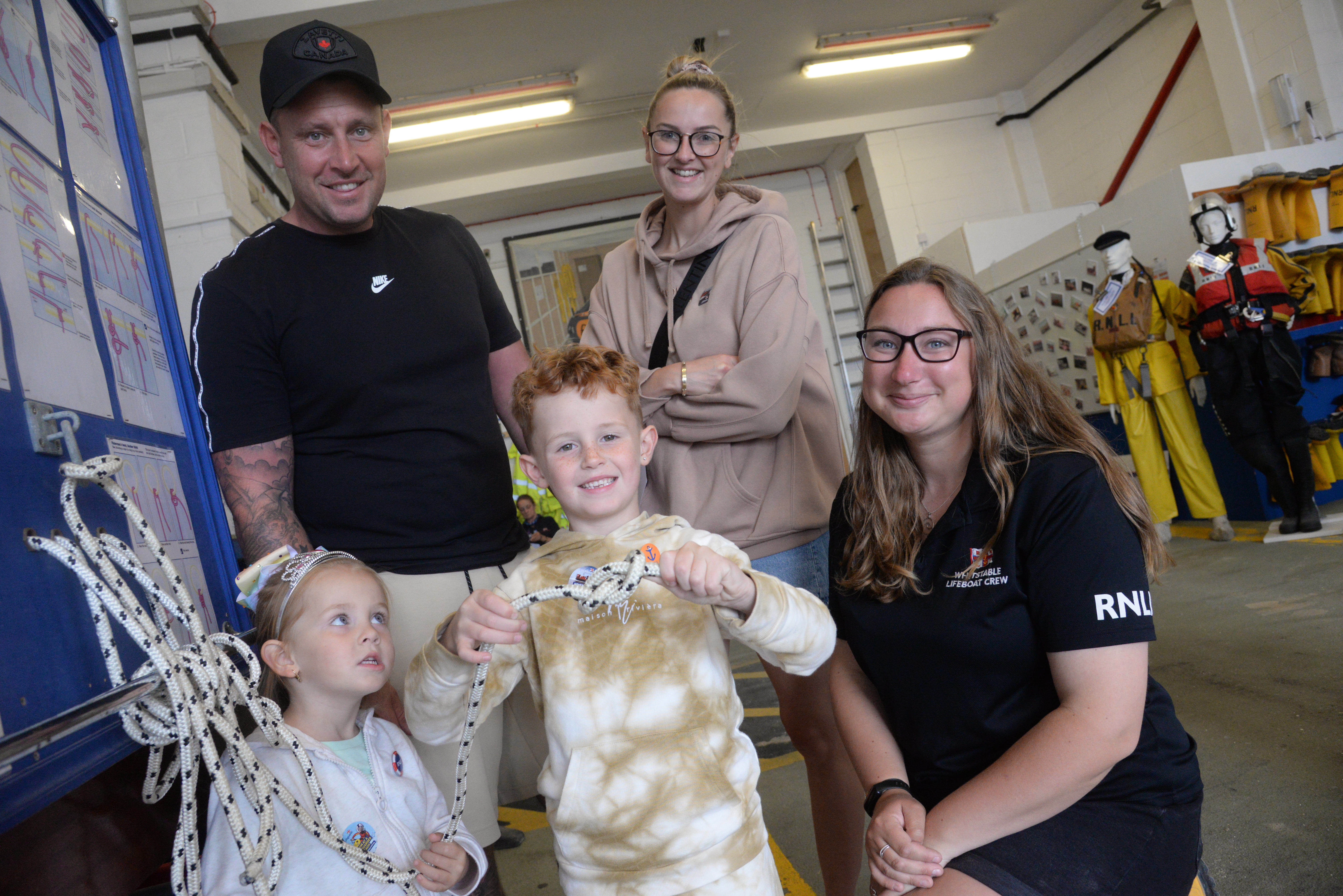 Peggy, four and Ernie, six, are shown the ropes by Lifeboat Helm Ruth Oliver watched by Parents Jim and Callie Wade during the Whitstable Lifeboat open weekend and 60th anniversary celebrations.