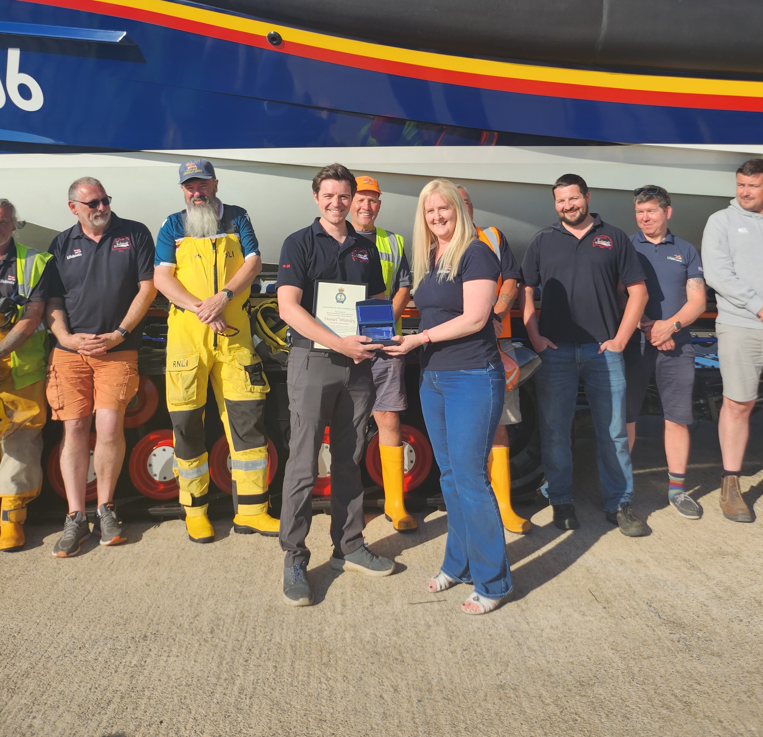 RNLI Regional Media Officer, Claire presenting Dan with the Excellence in Volunteering Award