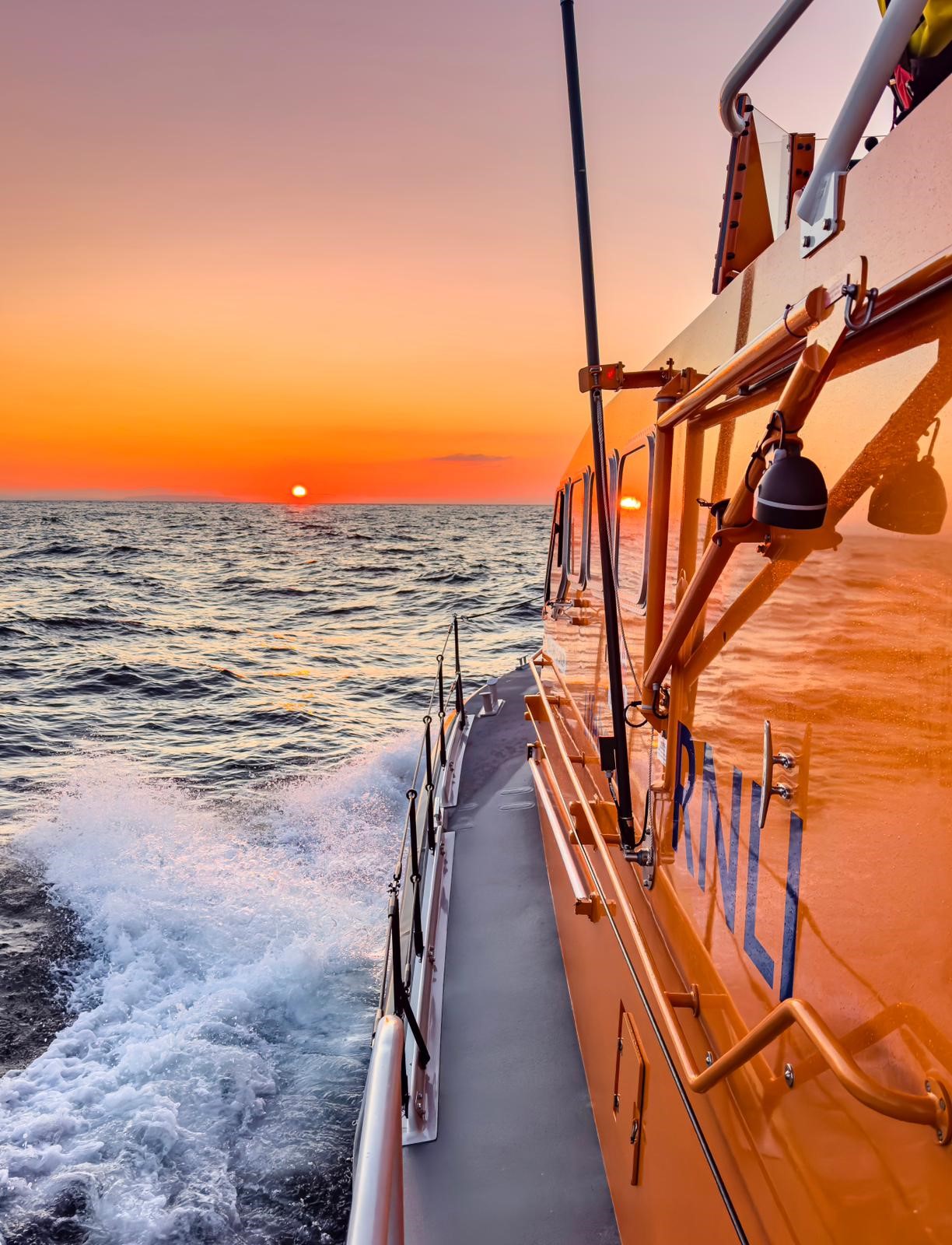 Porthdinllaen RNLI LIfeboat making best possible speed towards stricken yacht