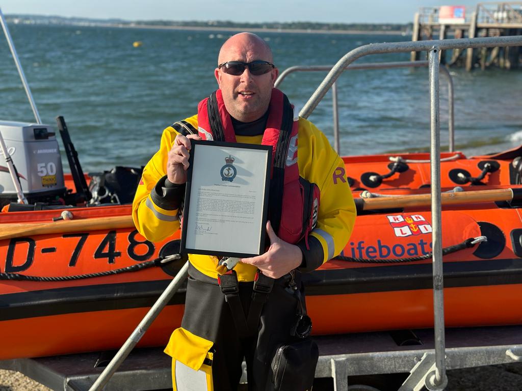 Calshot RNLI Crew Member Andy Headley with his medical director commendation