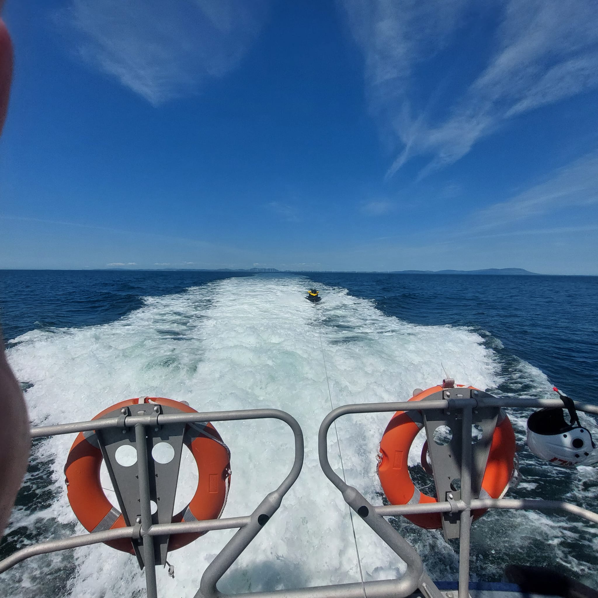 Workington RNLI towing jetskier 