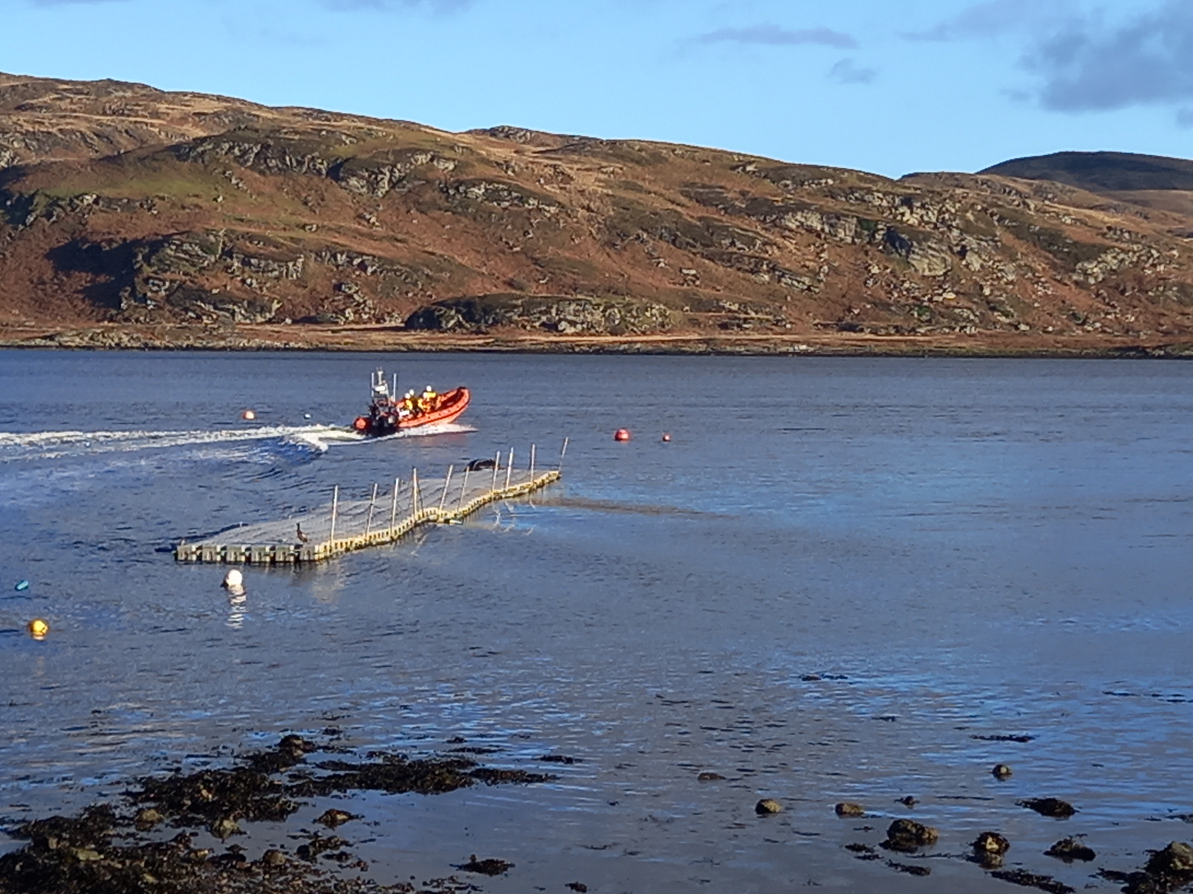 Inshore lifeboat pulling away from shore