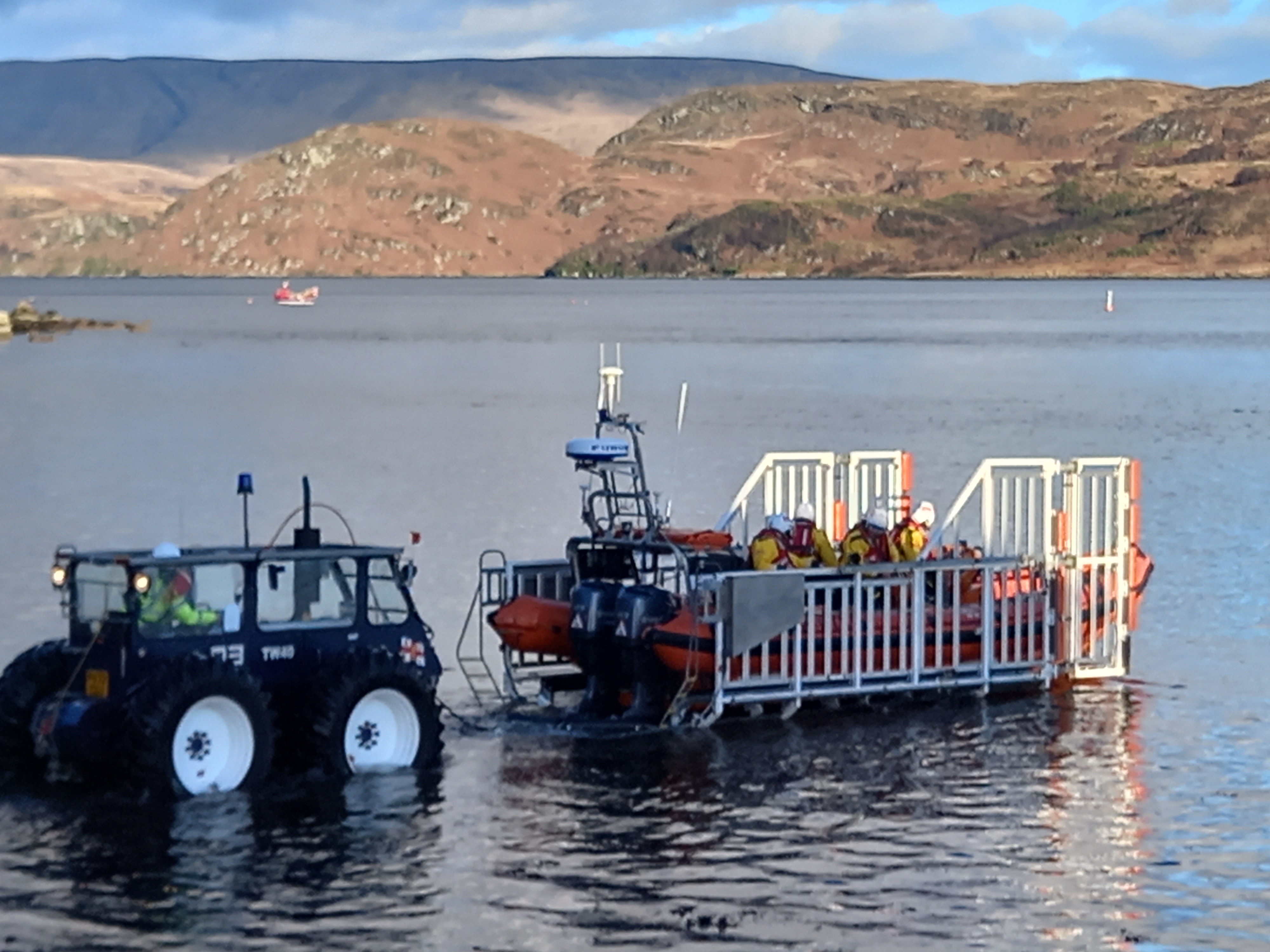 The DODO tractor and trailer take the lifeboat out from the shore for launch