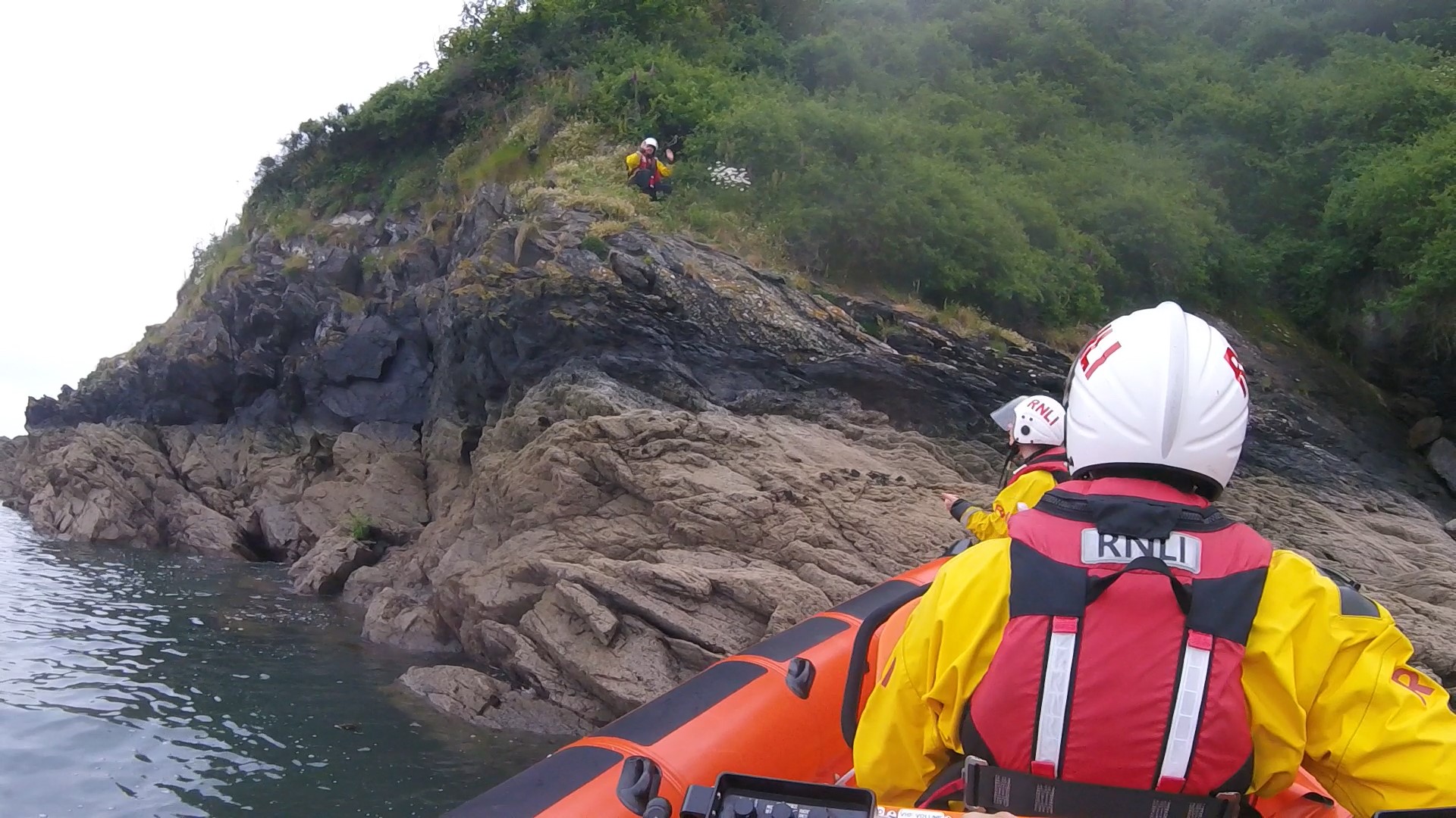 Inshore lifeboat crew member ashore at the scene of the incident