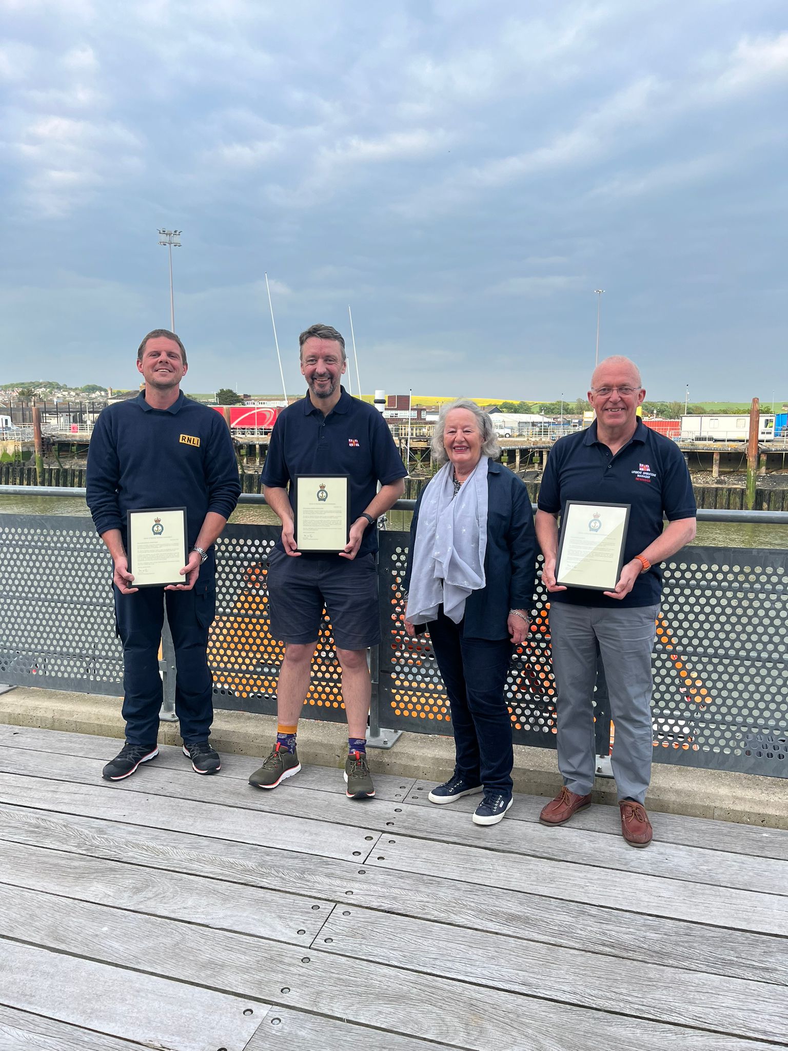 Lewis Arnold, Chris Glasspool, Jane King and Roger Cohen MBE stand together