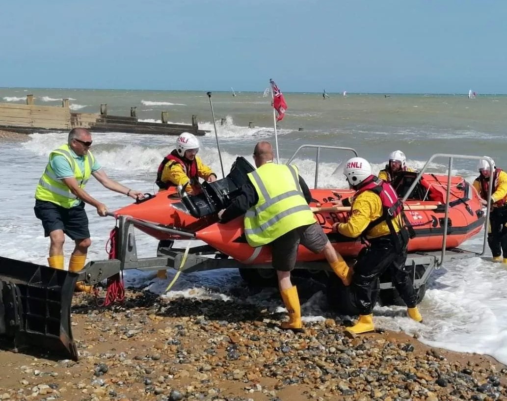 Photo of the Eastbourne inshore lifeboat is recovered from the beach.