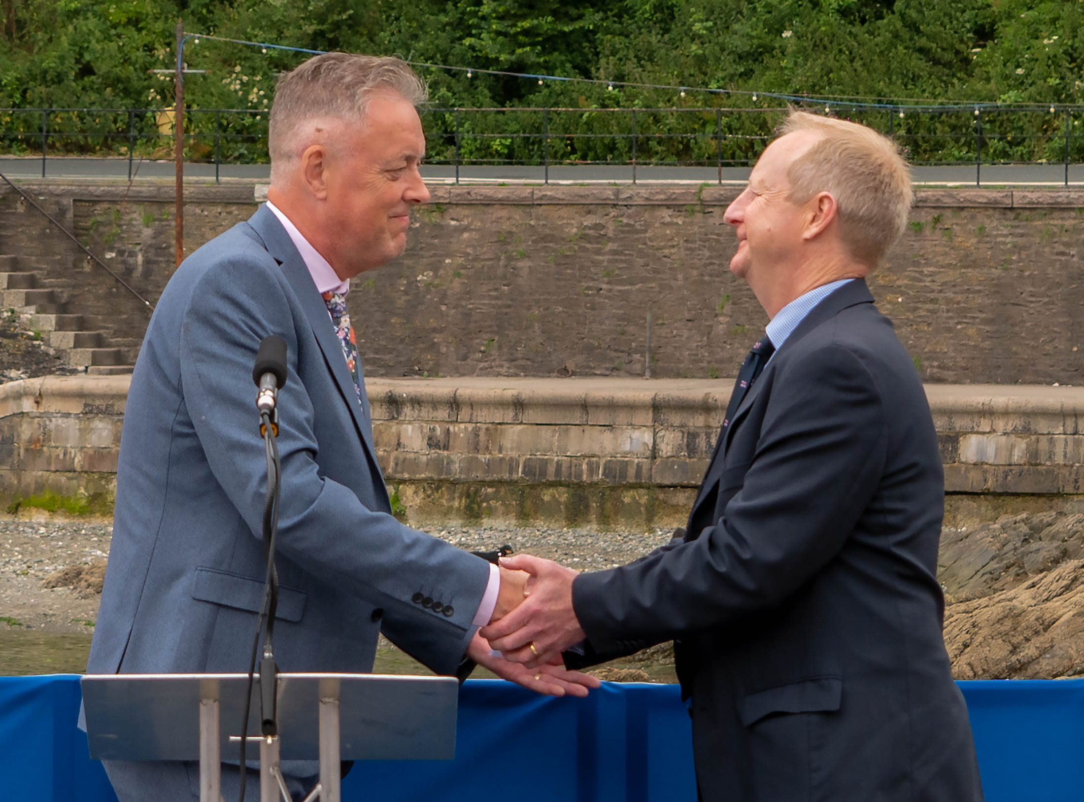 John Naismith handing the Ollie Naismith II to Adrian Carey and into the care of the RNLI
