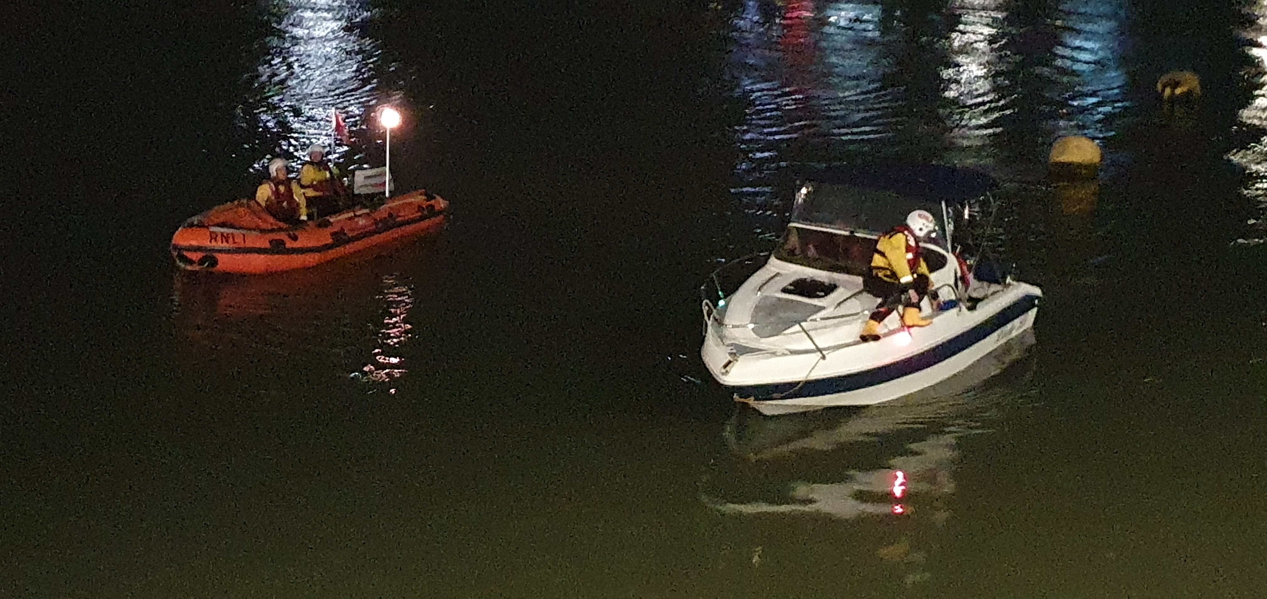 lifeboat escorting vessel to Rhyl harbour