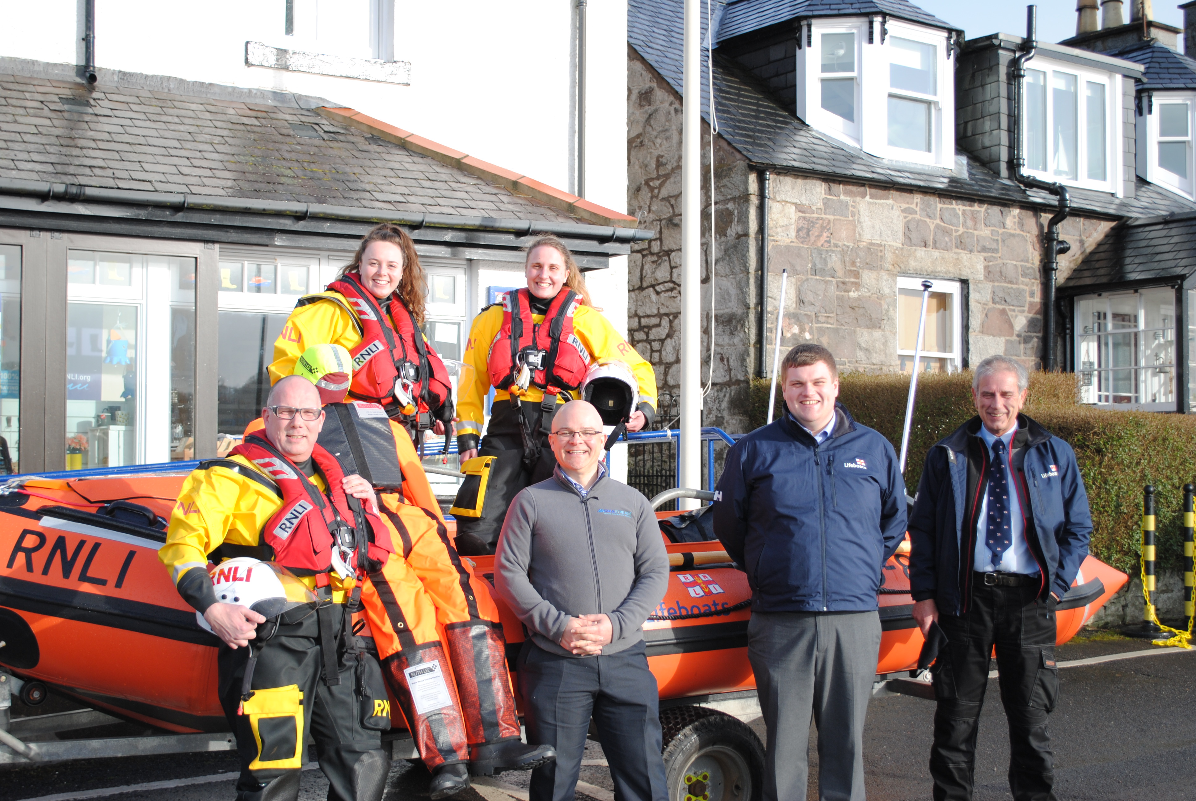 Kippford RNLI crew receive rescue dummy from Andy Milner
