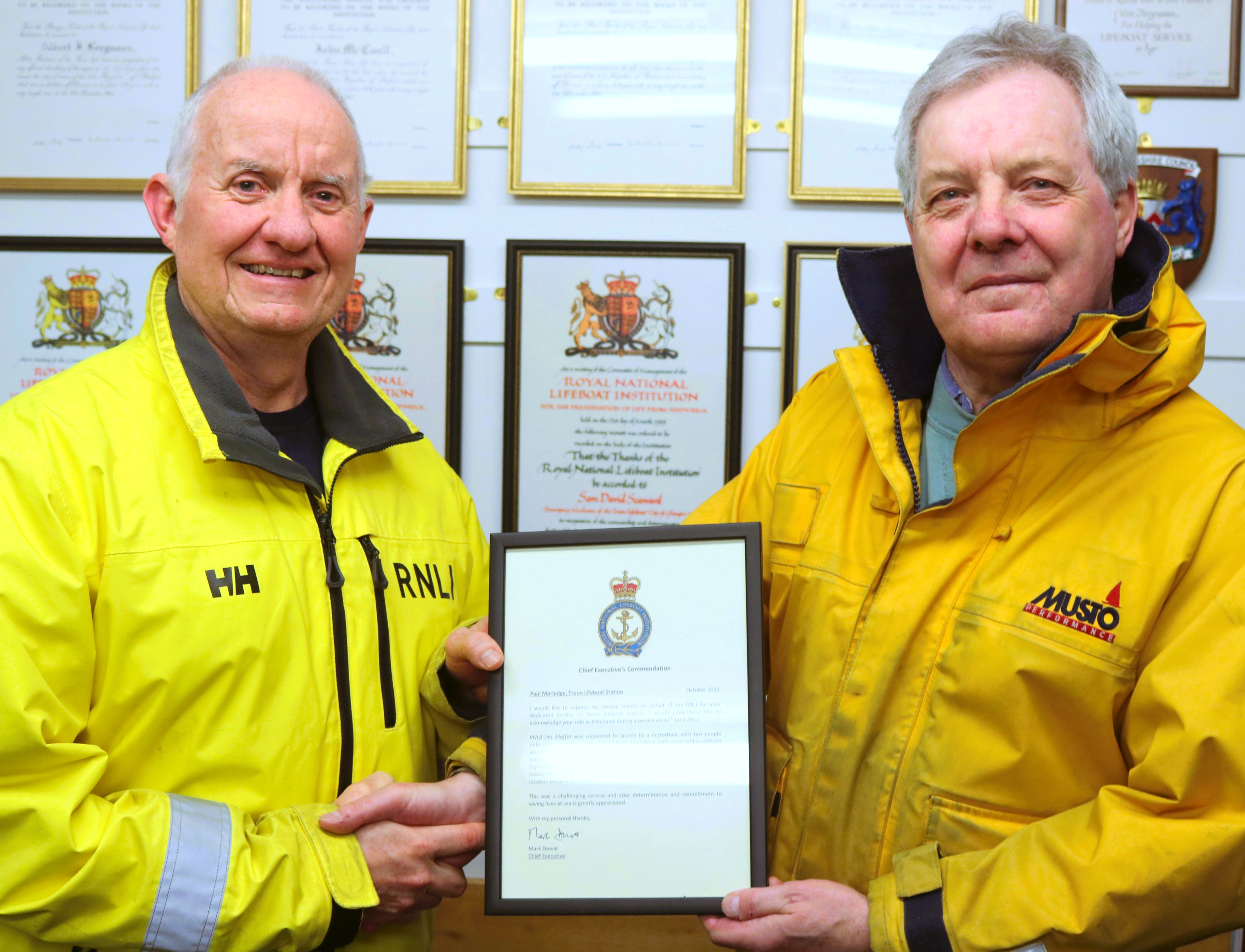 Crew member Paul Morledge receiving his signed certificate from Jim Redmond, Troon Lifeboat Operations Manager