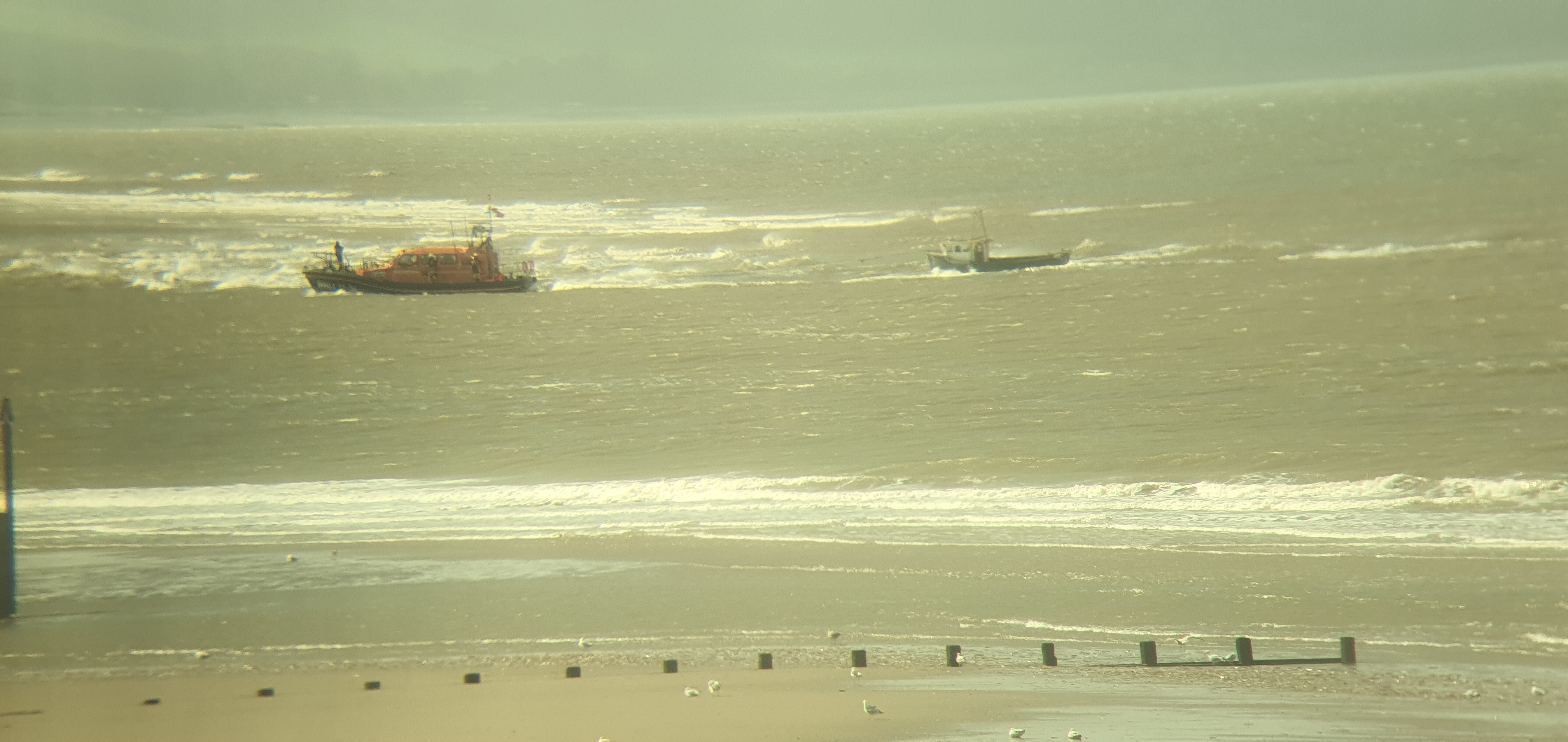 Rhyl lifeboat towing casualty into harbour