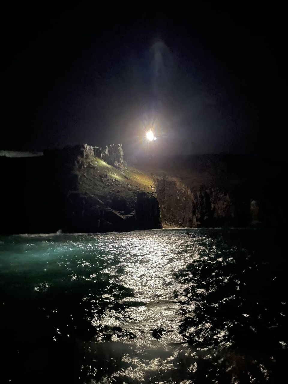 Shows helicopet lights illuminating scene
