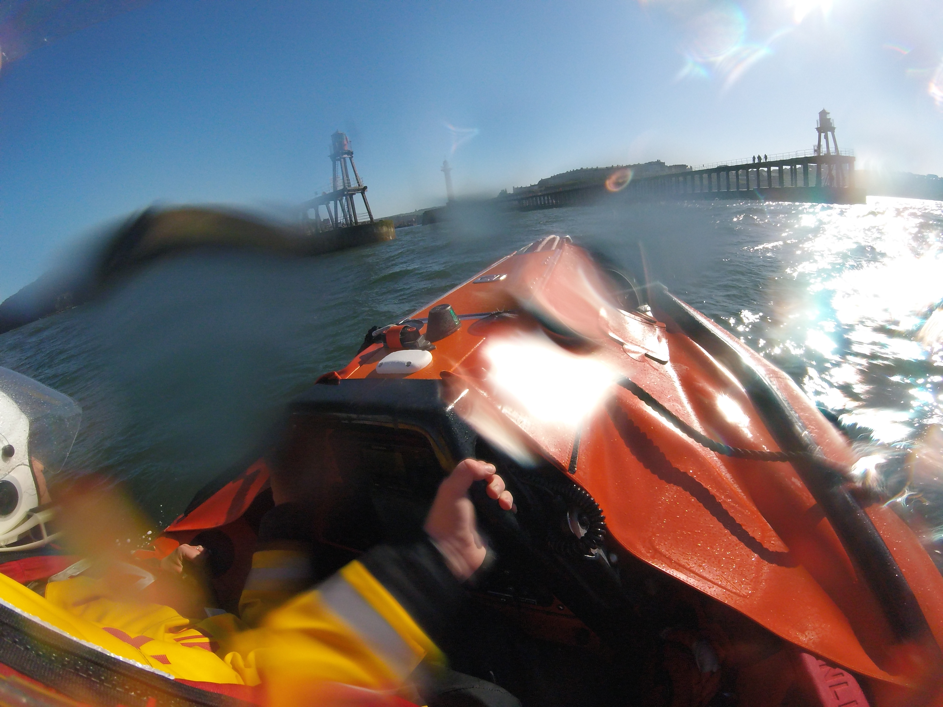 A head cam shot of the front of the inshore lifeboat as it heads into Whitby harbour.