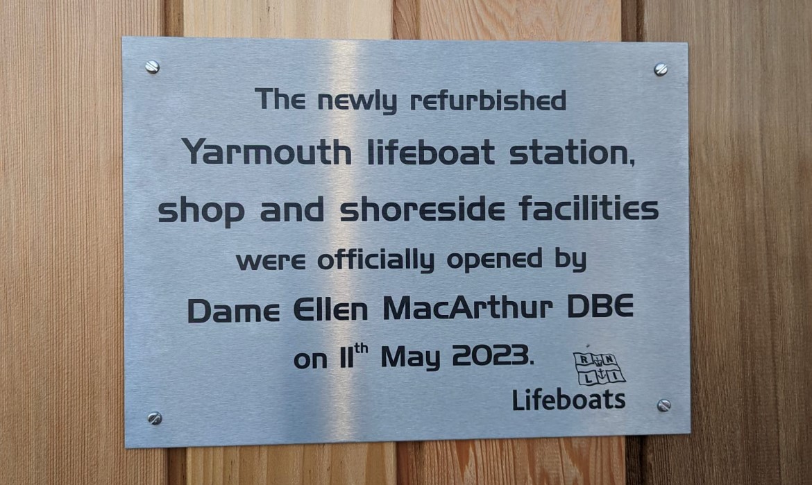 Photo of the plaque on the side of the Mechanic's Workshop which was unveiled by Dame Ellen MacArthur.