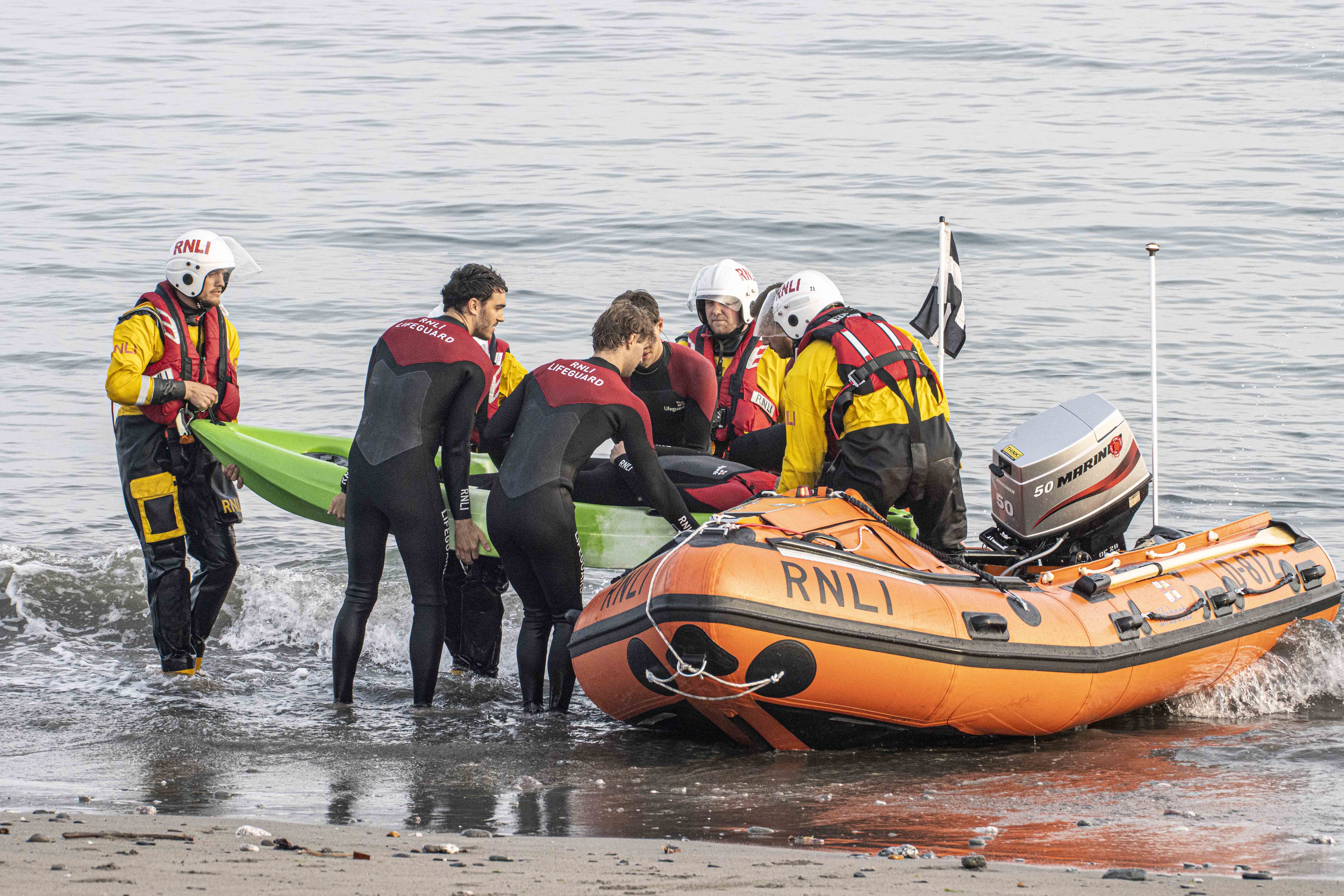 Looe RNLI volunteer crew training with RNLI SE Cornwall lifeguard team