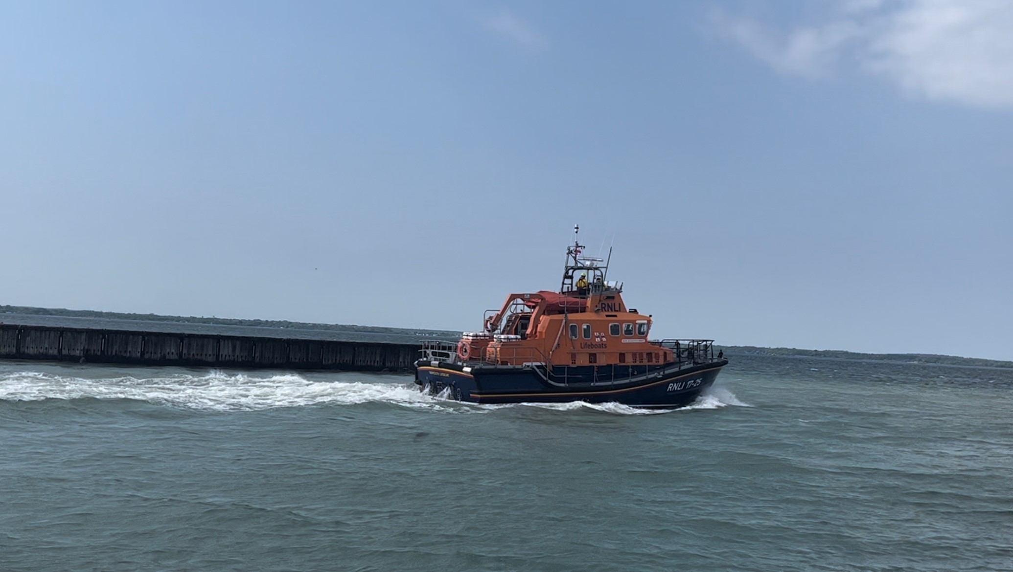 Photo showing the Yarmouth Lifeboat 17-25 'Eric and Susan Hiscock ‘Wanderer’ at sea and heading right.