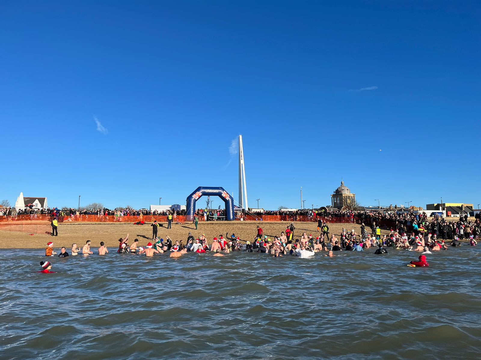 Brave fundraisers swimming in the cold sea on Boxing day