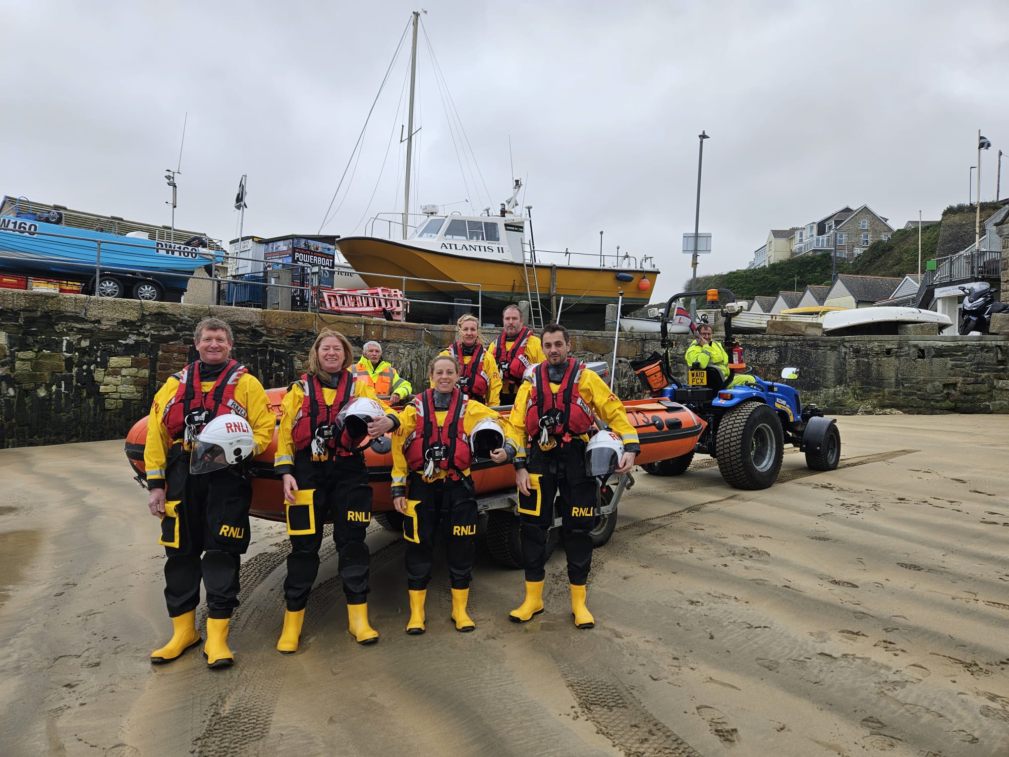 Newhaven Lifeboat crew front left to right: Andy Bull, Katherine Nasher, Claire Townsend, Dan Wittenberg. Newquay Lifeboat crew back left to right: Kev Goulding, Kate Palmer, Andrew Trebilcock, Phil Morris