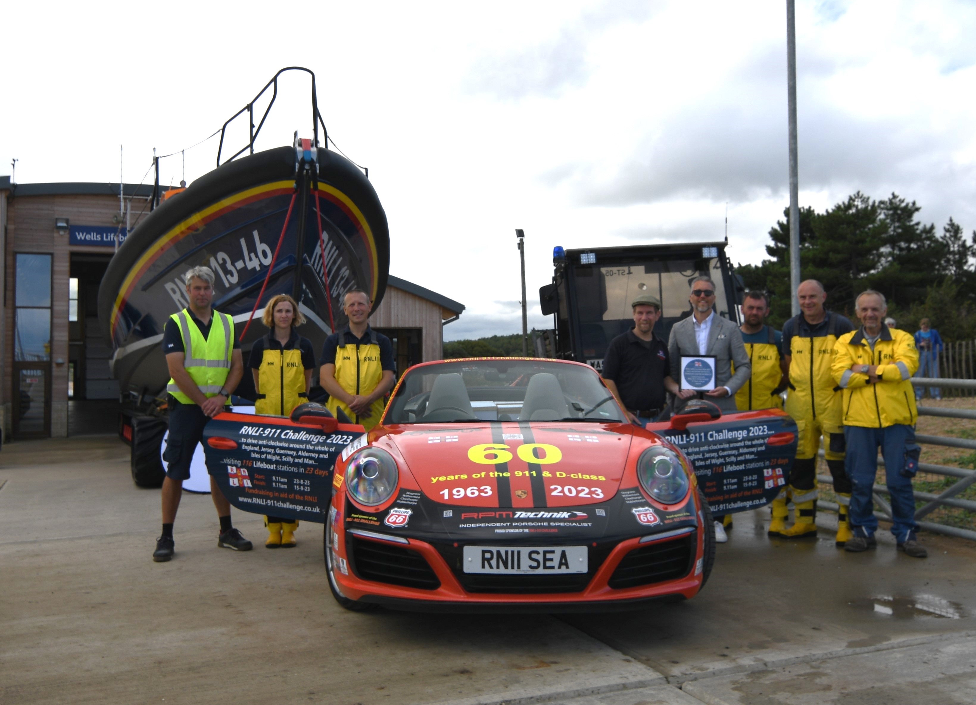 Wells RNLI played host to Belinda and James Richardson and their bright red Porsche 911, 'Splash', on Friday 1 September 2023.