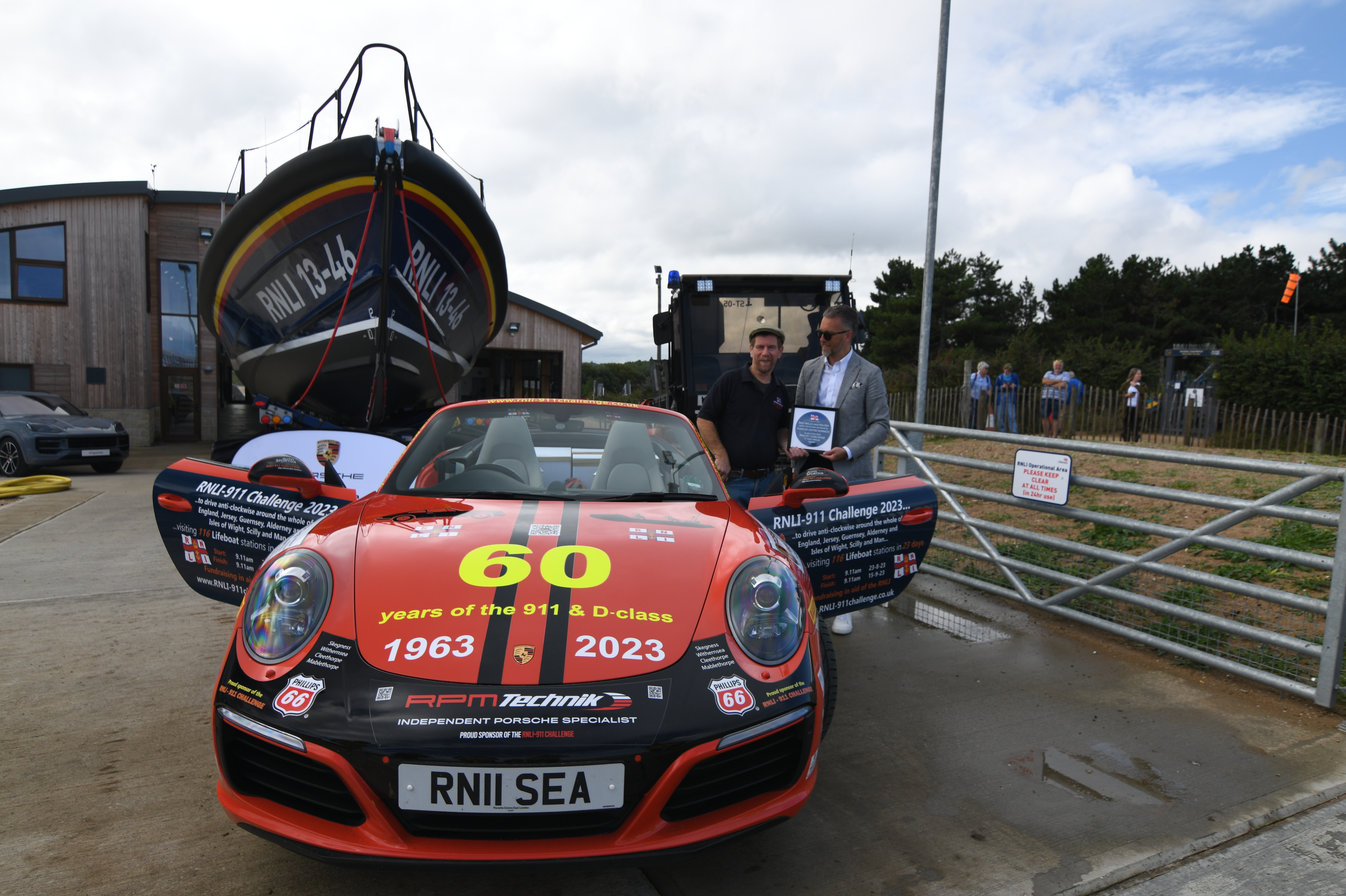 Wells RNLI played host to Belinda and James Richardson and their bright red Porsche 911, 'Splash', on Friday 1 September 2023.
