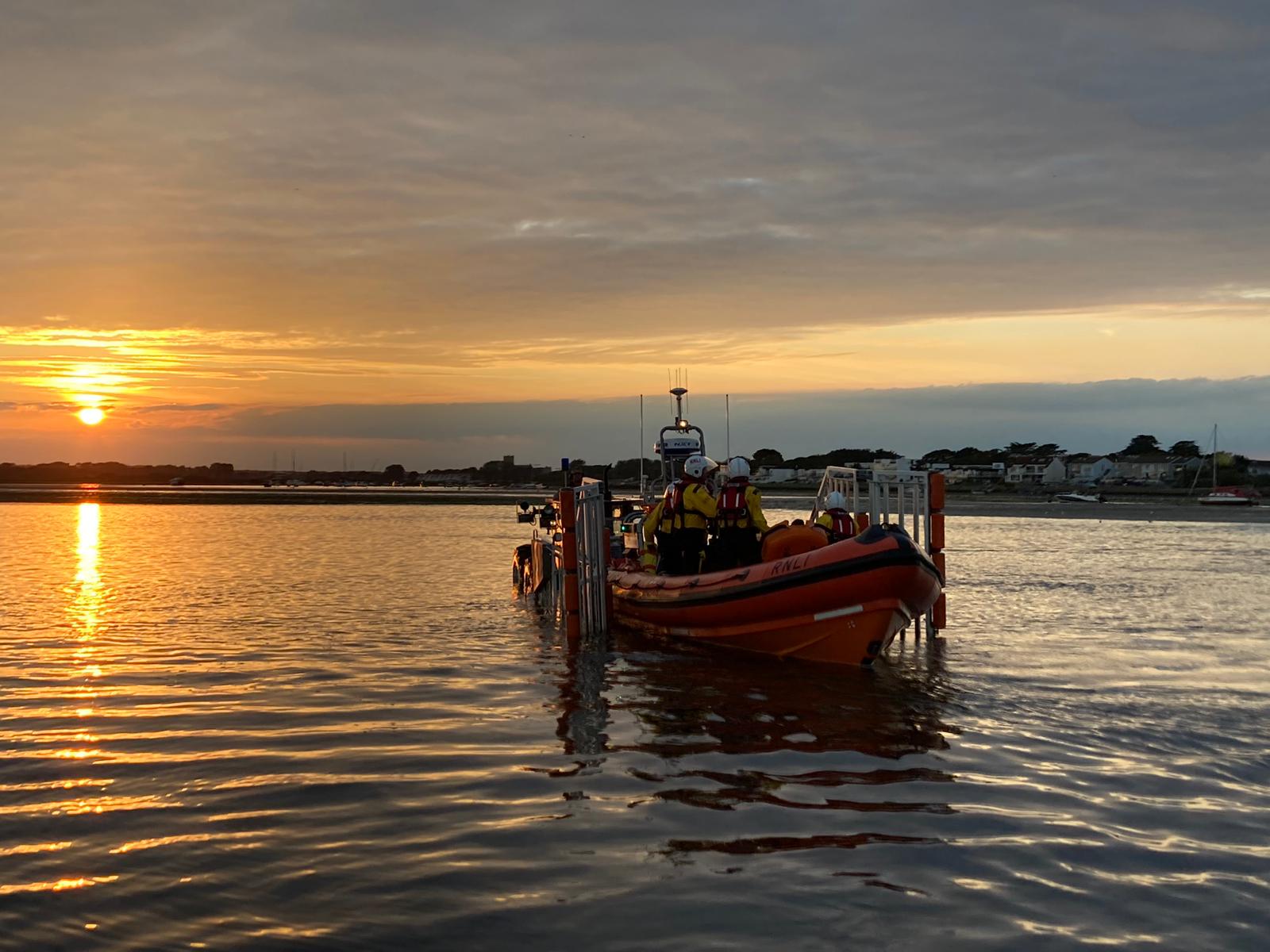 Sunset and the Mudeford Servant lifeboat and crew return to station after a long day at Bournemouth Air Festival