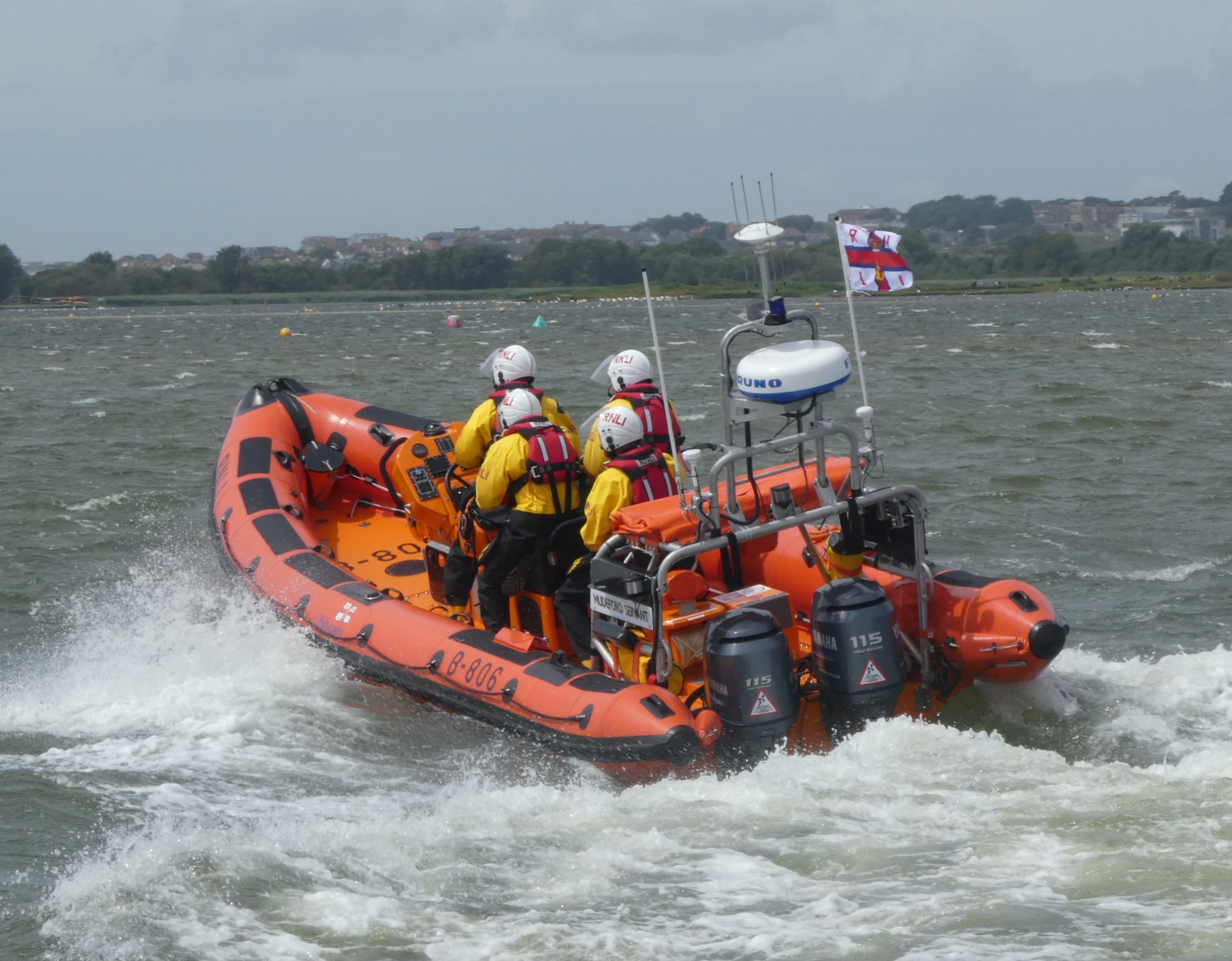 The Mudeford Servant Atlantic 85 lifeboat with 4 volunteer RNLI crew in Christchurch Harbour