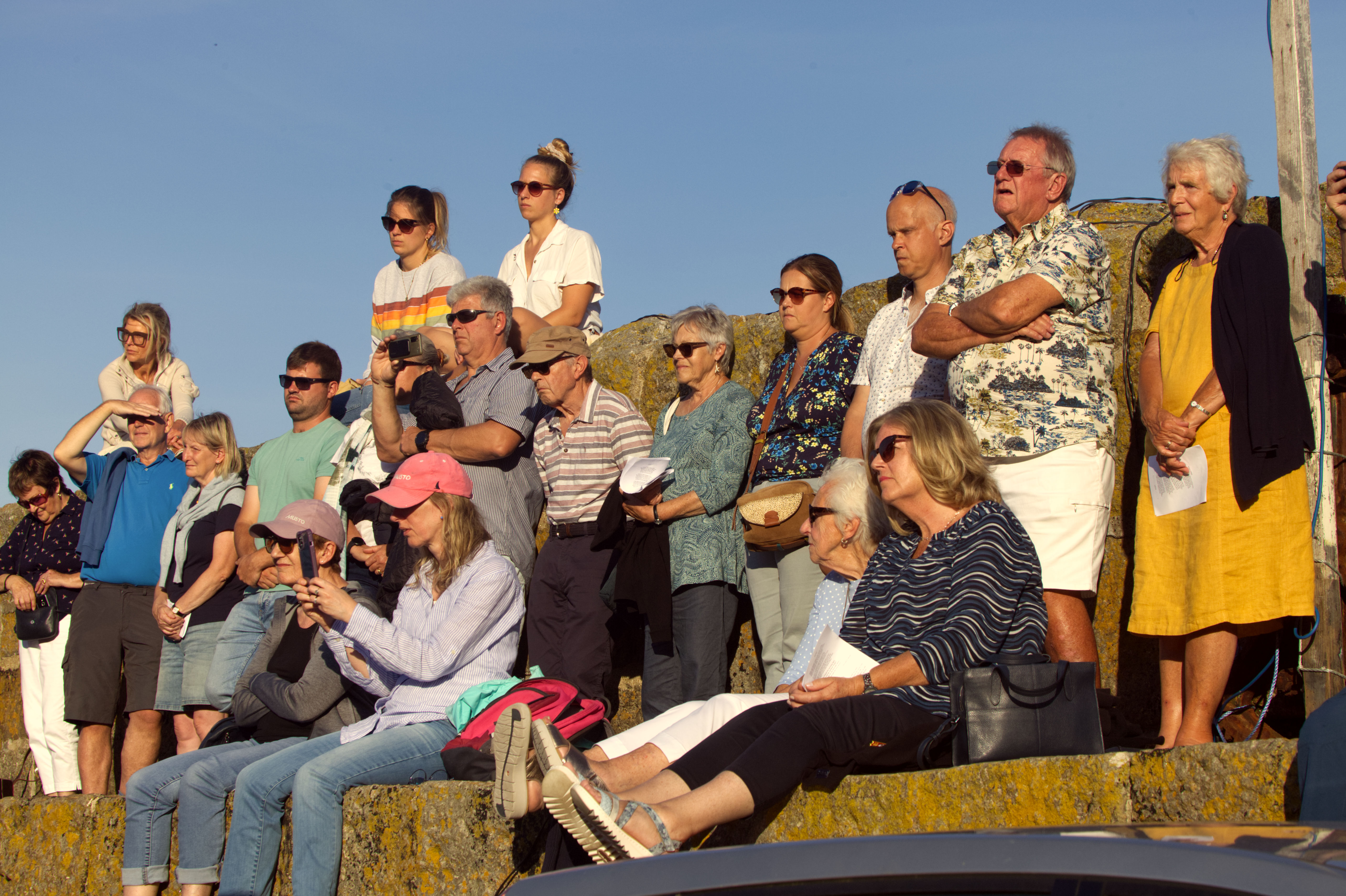 A group of people watching the lifeboat service