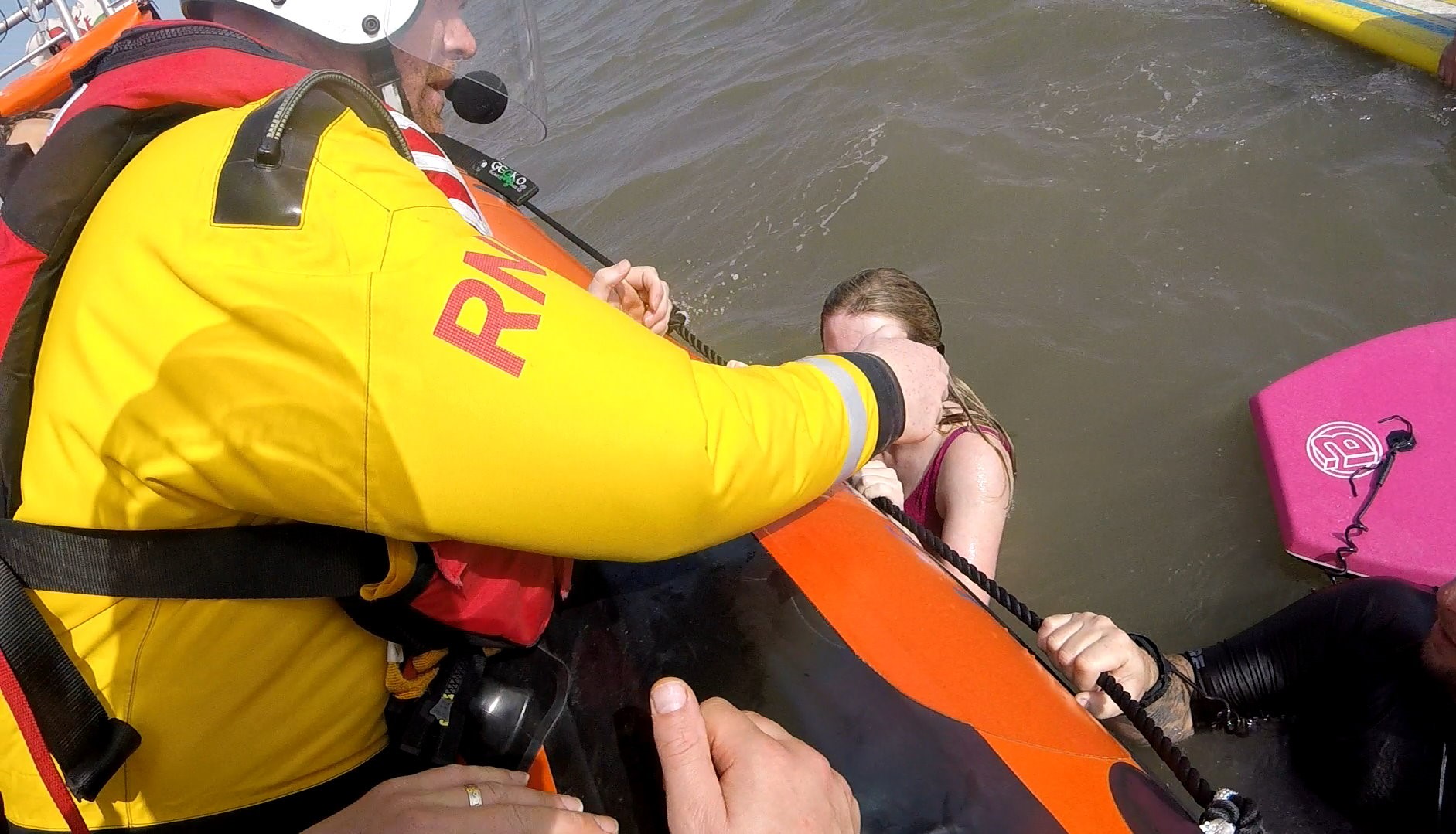 Swimmers are helped onto the Atlantic 85 lifeboat