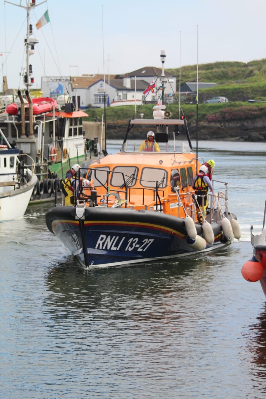Wicklows shannon class lifeboat returning from the callout. The crew are getting the boat ready to tie alongside.