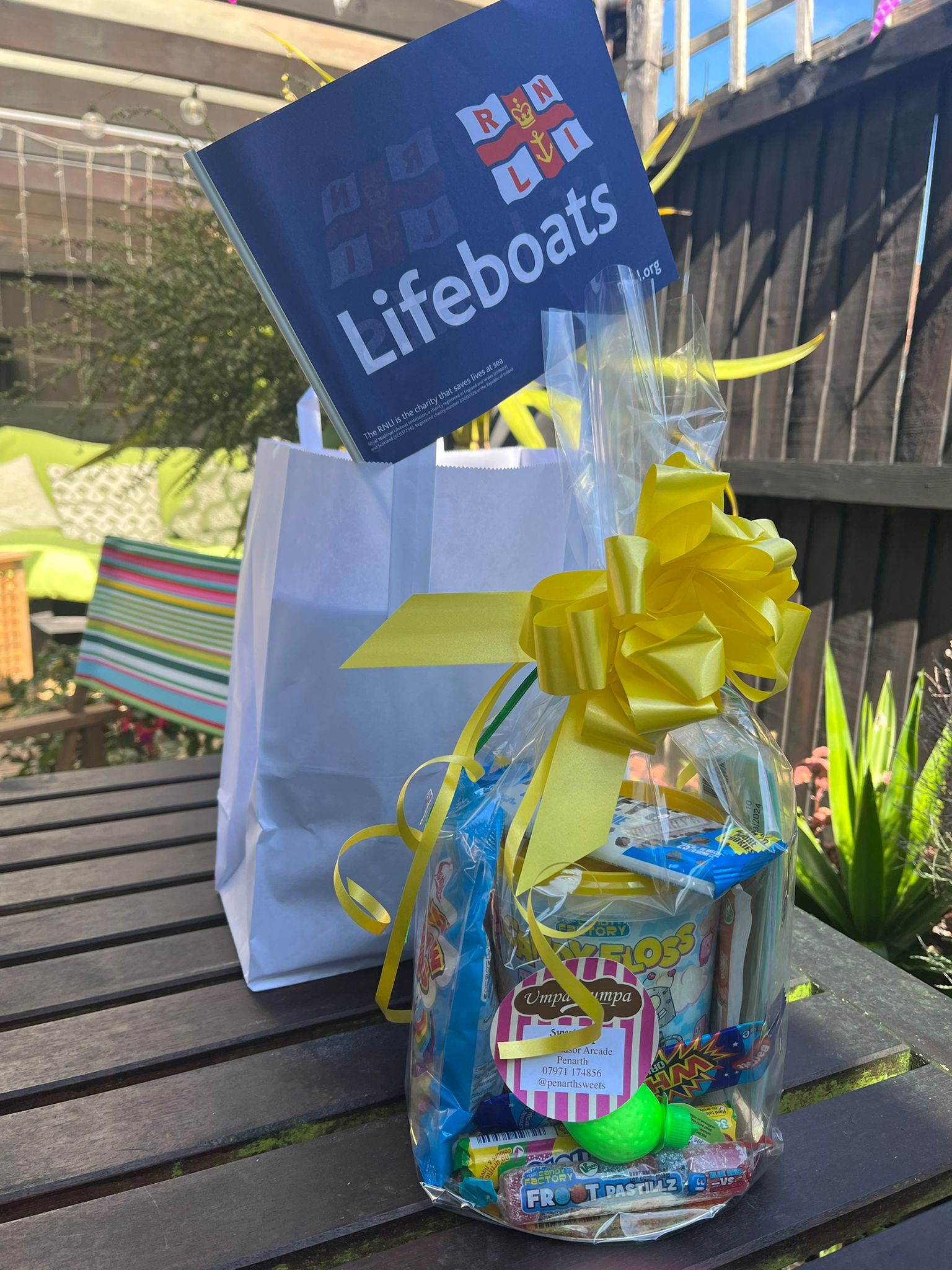 Sweet packs on table donated by Umpa Lumpa with RNLI flag 