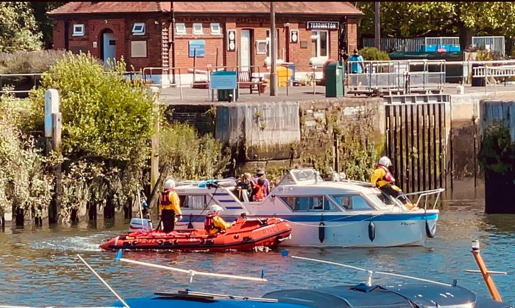 Lifeboat towed cabin cruiser back to a safe mooring.