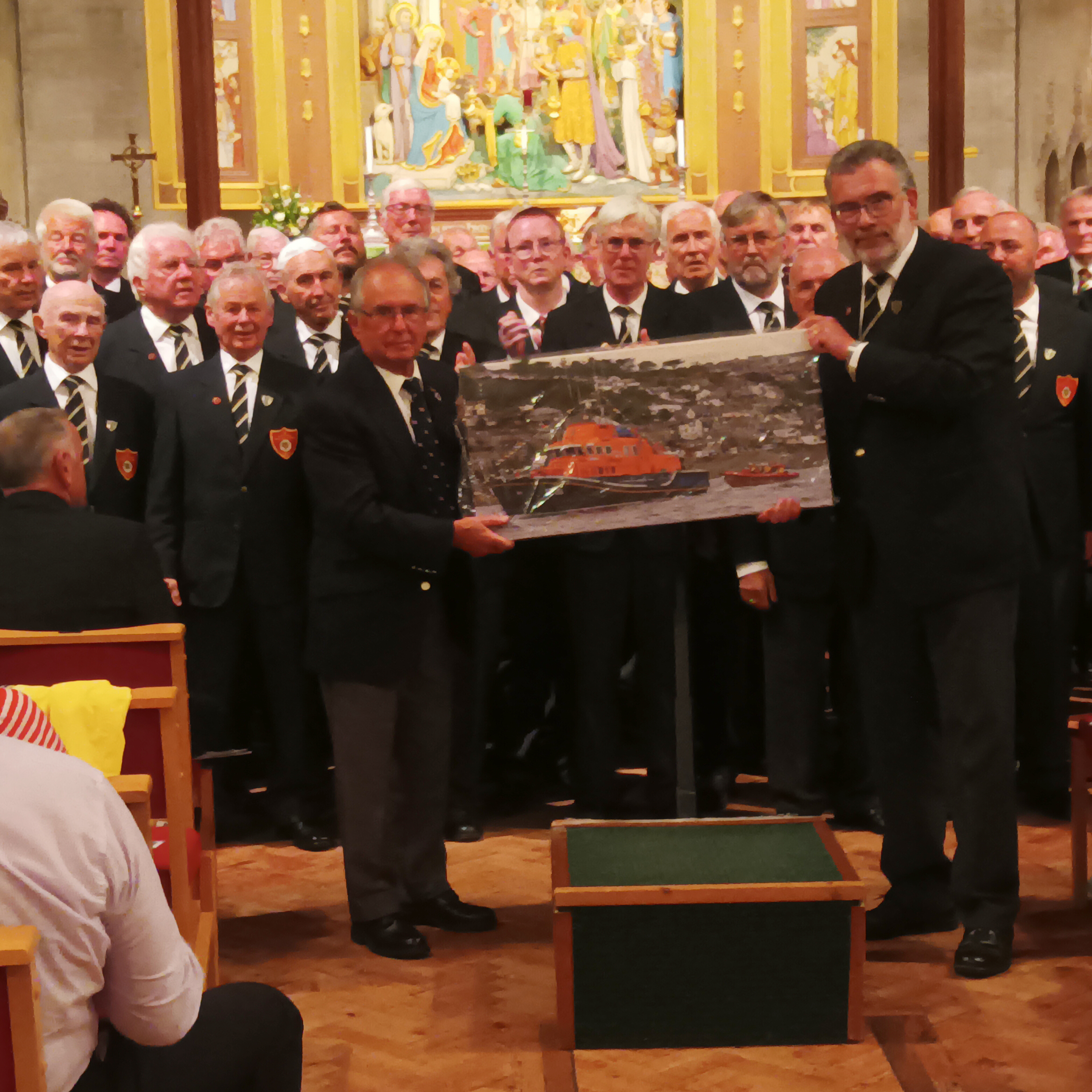 shows presentation of photo by two men