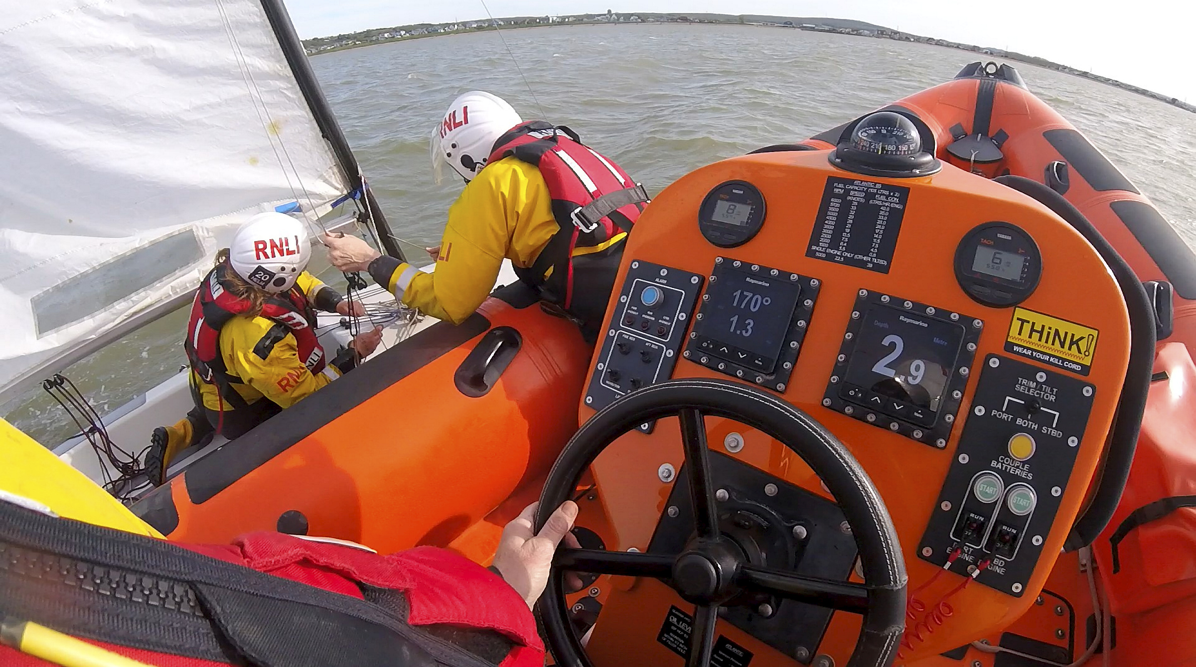 The lifeboat crew ‘right’ the dinghy alongside the lifeboat. Picture: RNLI Whitstable.