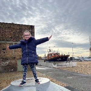 Gracie on a visit to the RNLI Museum in the Chatham Historic Dockyard. In the background is Mersey Class ALB 12-30 'Her Majesty the Queen' which is on display at the museum to mark the 200th anniversary of the RNLI.