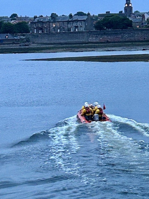 Berwick-upon-Tweed RNLI inshore lifeboat heading up the river Tweed