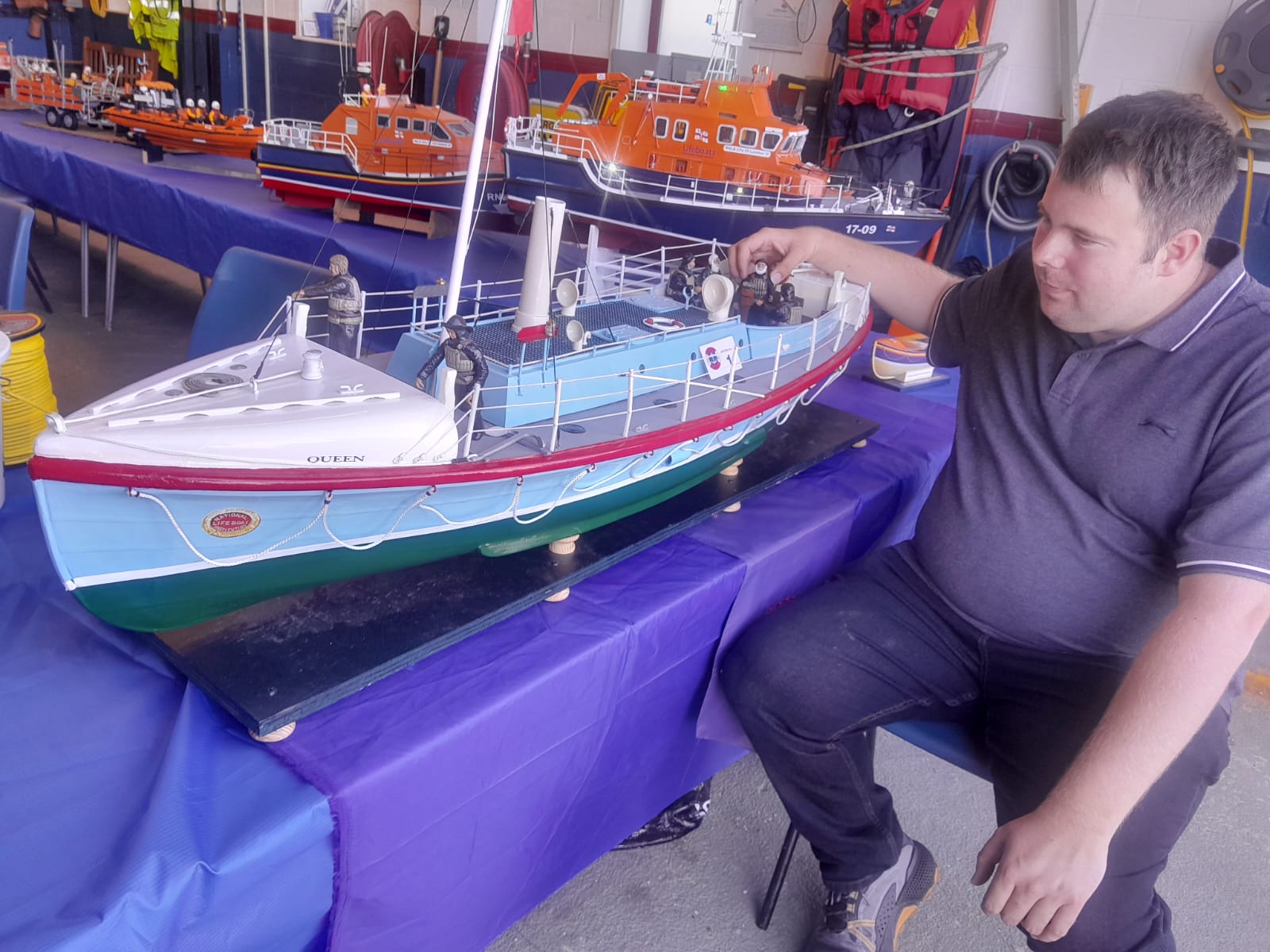 Adam Maplesden with a model of the steam powered lifeboat 'Queen' at the model lifeboat show to mark RNLI 200 at Whitstable RNLI on Sunday.
