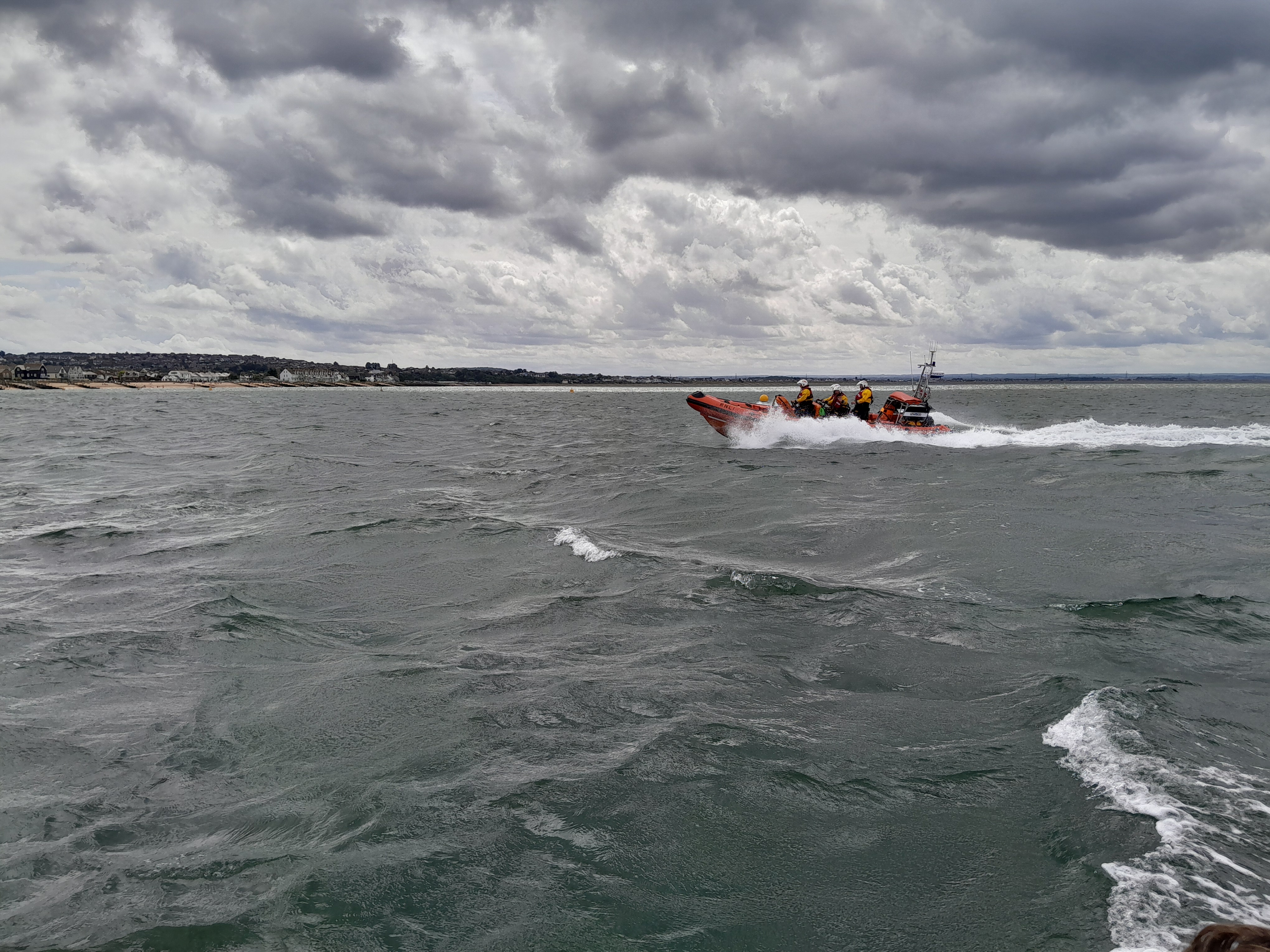 Under grey skies the Whitstable lifeboat returns to station from an exercise prior to being tasked to search for two kayakers reported to be in difficulties off Whitstable on Saturday.