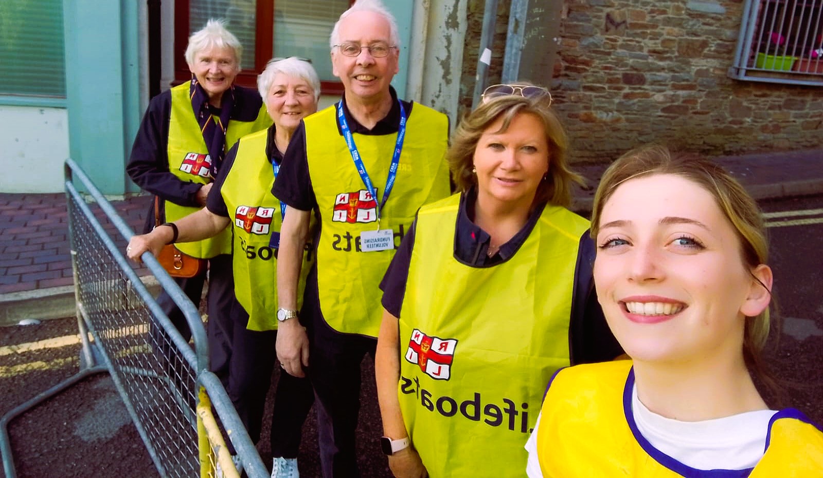 5 RNLI Volunteers In RENLI Yellow bibs
