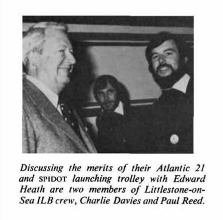 A black and white photo from the late 1970s of Charlie Davies meeting former Prime Minister Edward Heath on the RNLI stand at the London Boat Show