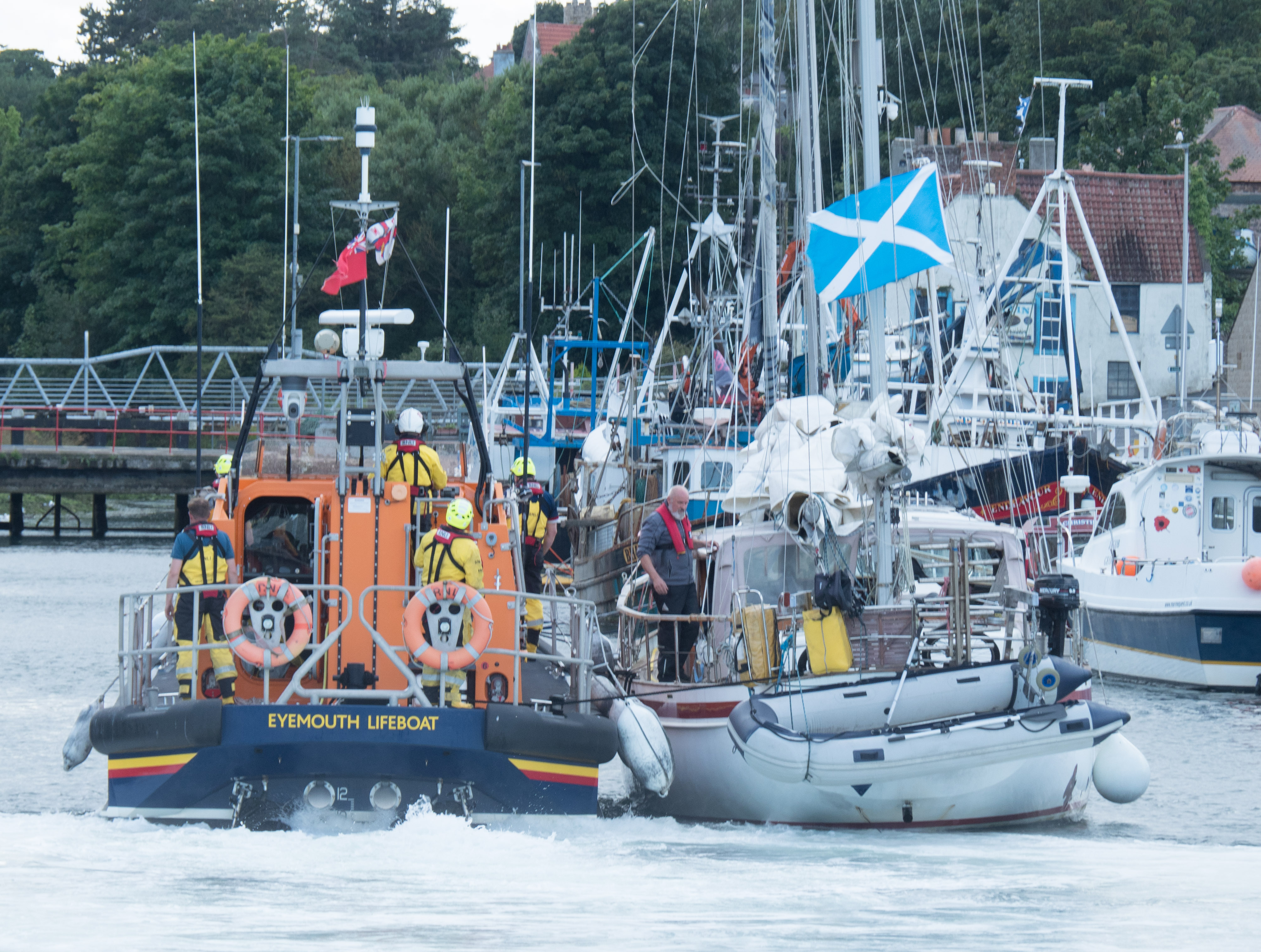 Eyemouth RNLI volunteers tow casualty yacht into Eyemouth harbour after the yacht had engine failure at the Hurkar rocks